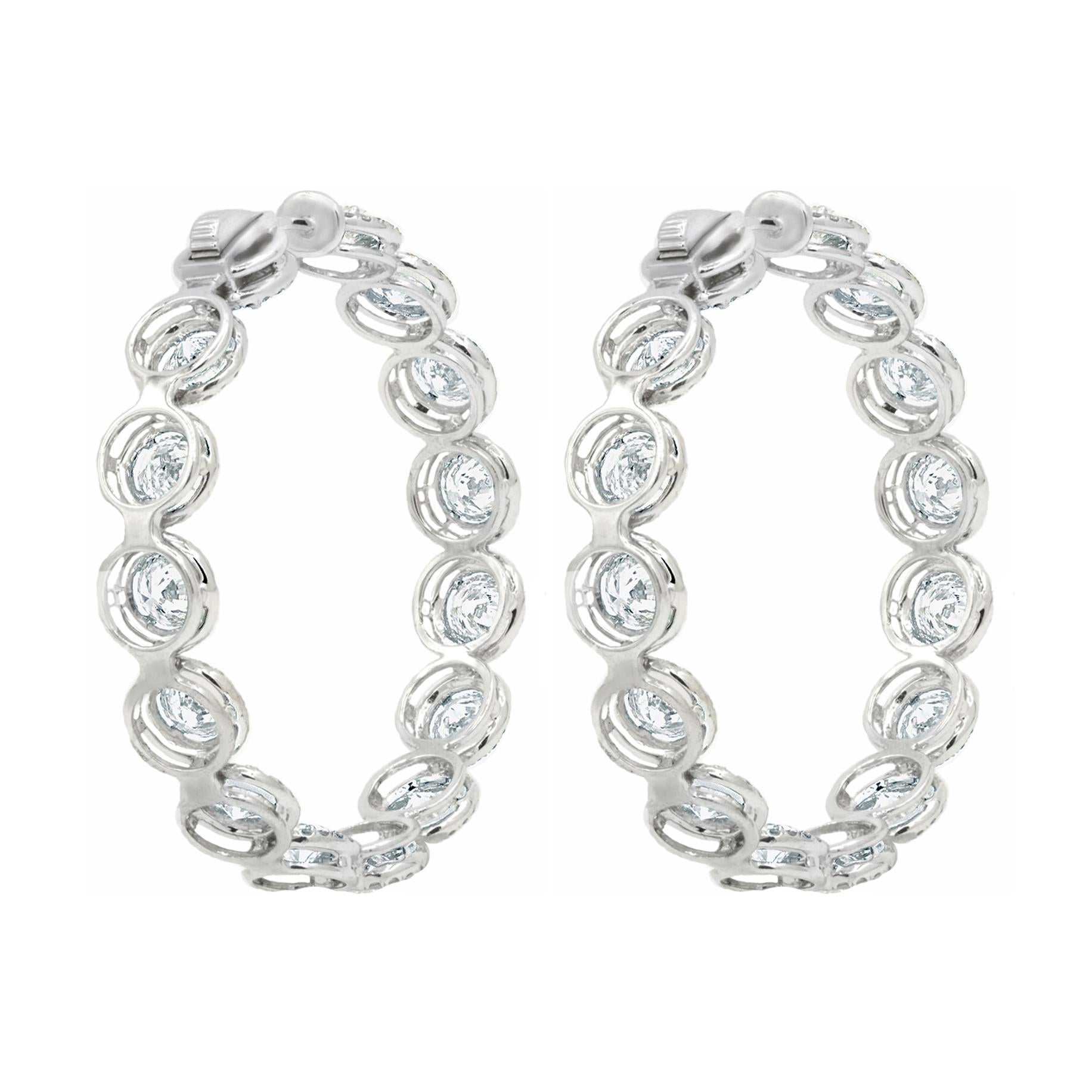 18KT gold Gorgeous diamond hoop earrings, features 12.20 Carats of diamonds, each stone is approximately 0.40 carats.