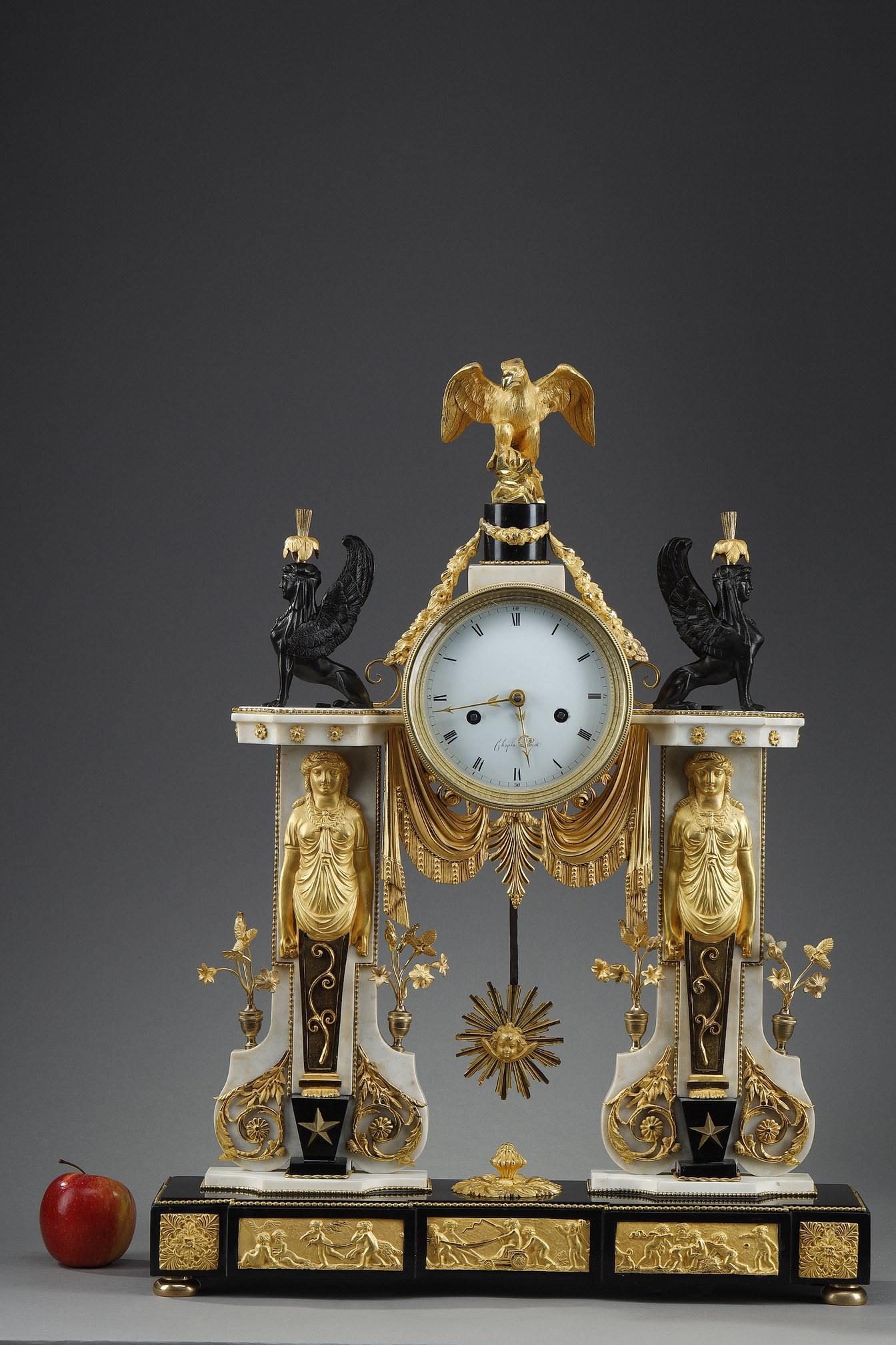 Majestic Directoire period clock in white and black marble adorned with gilt and patinated bronzes. In the 