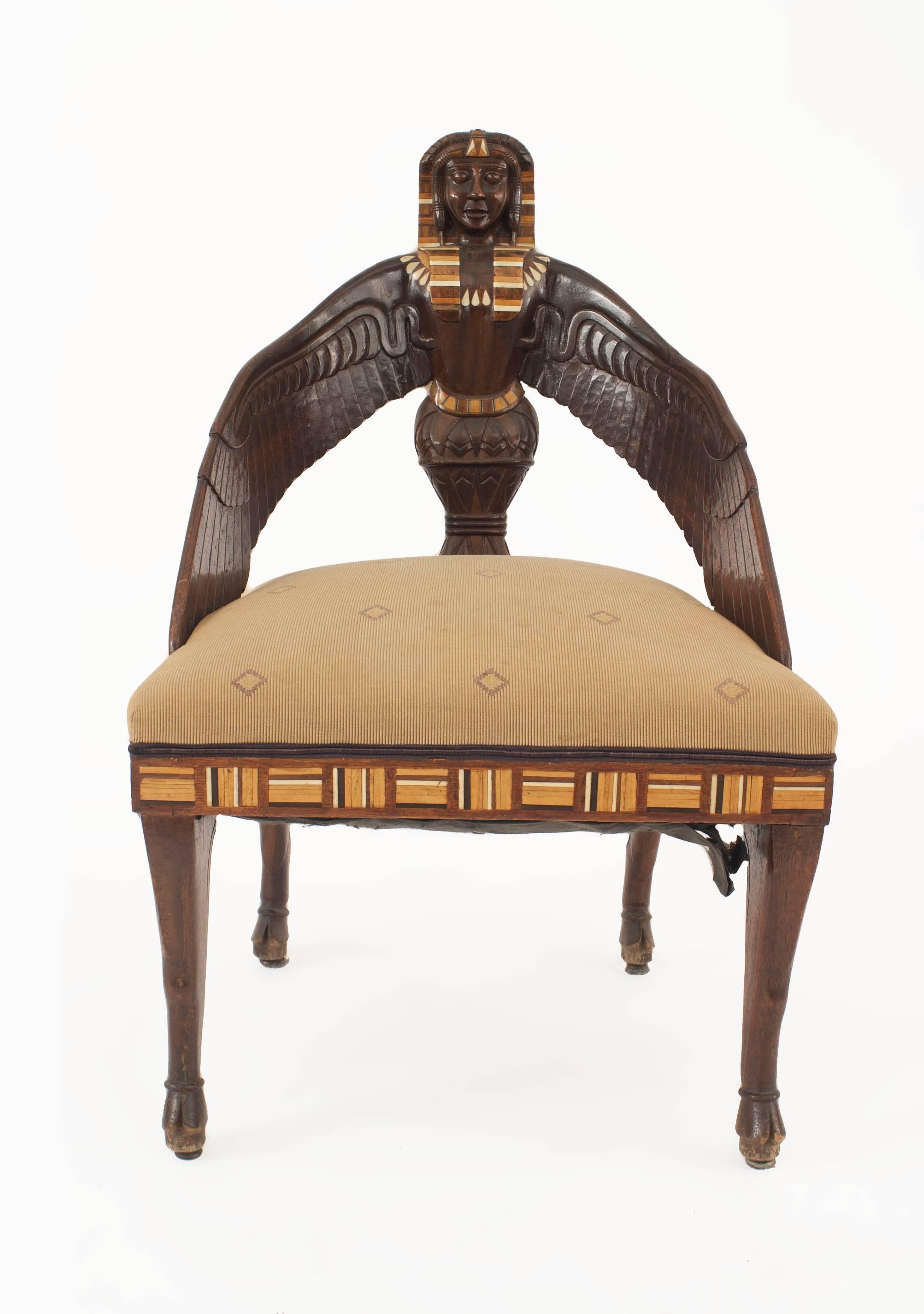 4 Middle Eastern Egyptian style (19th Century English) Macassar ebony chairs with carved wing back centering a sphinx head with pearl, and inlaid trim, 2 with gray faux snakeskin upholstery, and 2 with gold diamond patterned upholstery. (PRICED