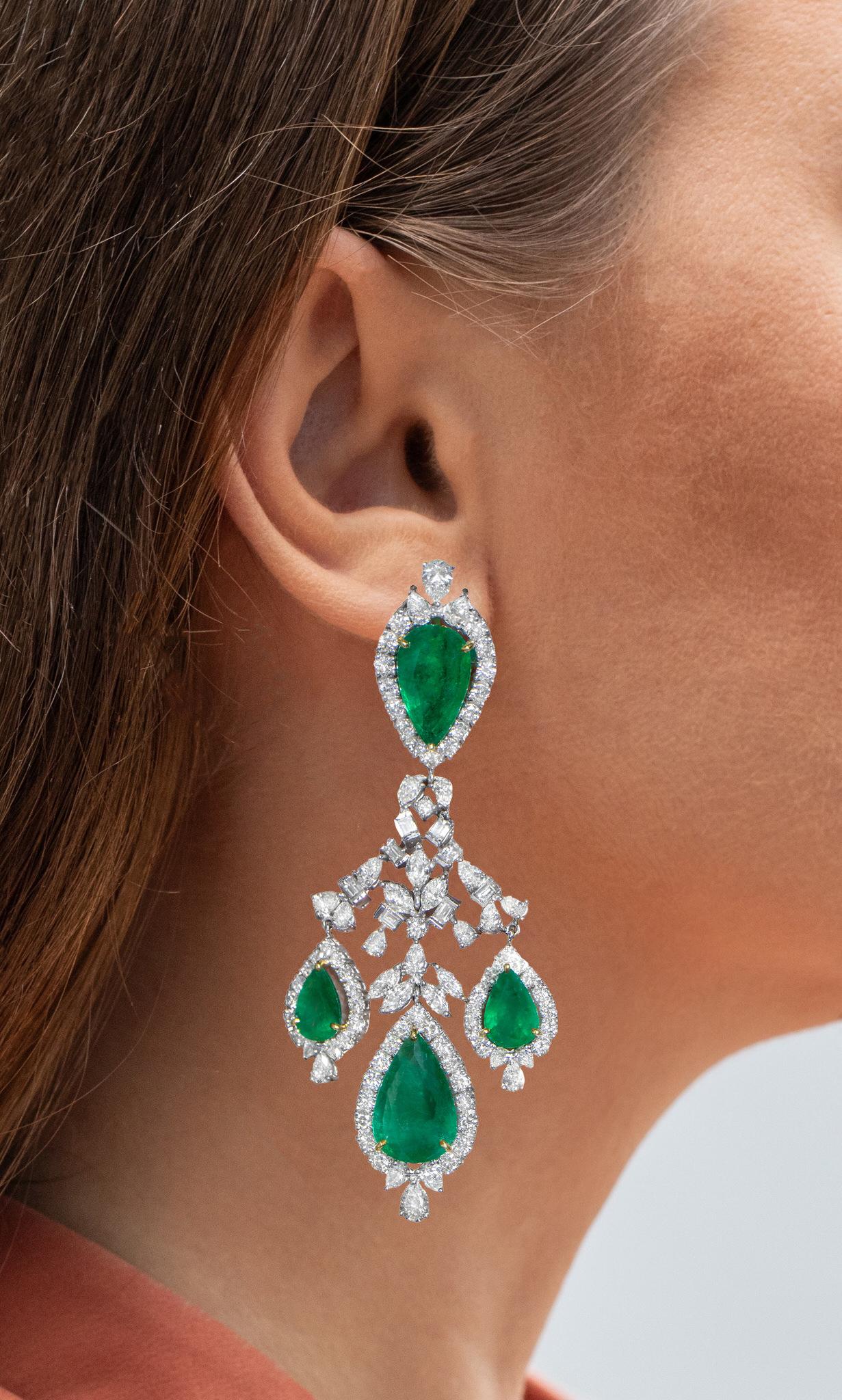 It comes with the Gemological Appraisal by GIA GG/AJP
All Gemstones are Natural
Emeralds = 23.35 Carats
Diamonds = 15.34 Carats
( Color: F-G, Clarity: VVS-VS )
Metal: 18K White & Yellow Gold
Dimensions: 85 x 37.5 mm