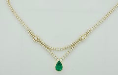 Importante collana di smeraldi e diamanti in oro giallo 18 carati