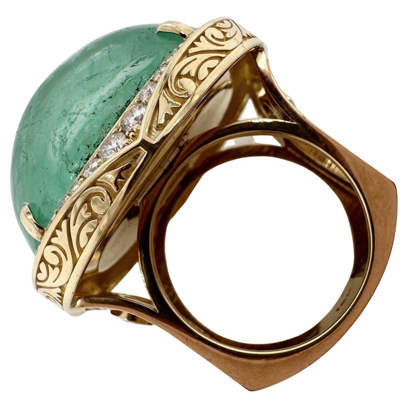 Rare emerald cabochon 100% naturl and untreated made in a complex cocktail ring in 18KT yellow gold with lots of small details, exquisite workmanship, VS diamonds and hand finsih throughout. This is a one of a kind ring that will get tons of