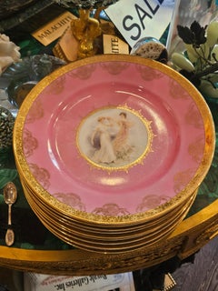 Importante lote de 10 platos Heinrich de porcelana rosa pintada con borde de oro de 24 quilates