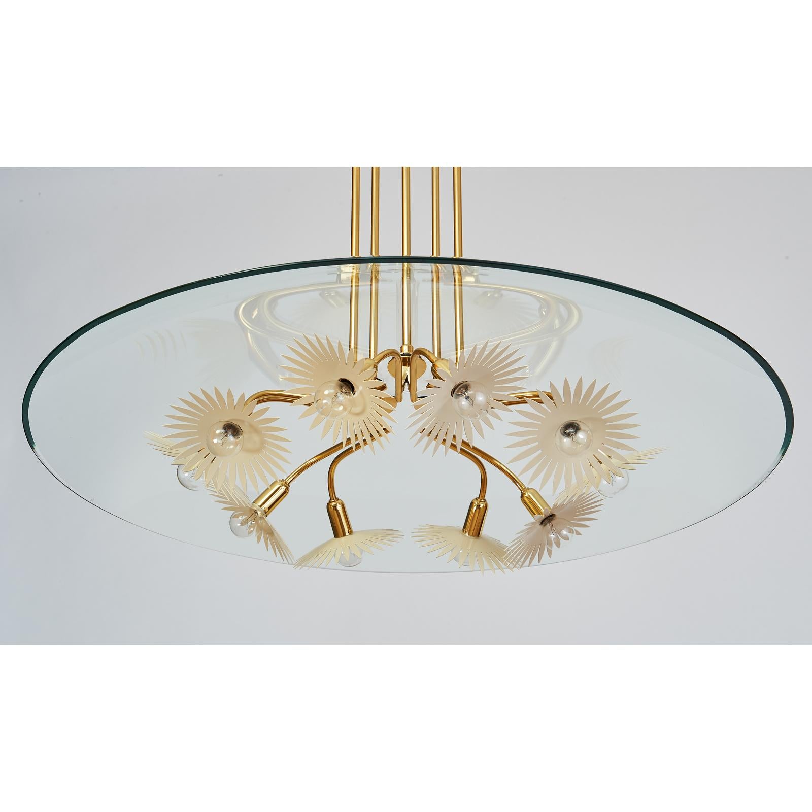 Pietro Chiesa (1892-1948) for Fontana Arte
A magnificent ten branch chandelier in polished brass with clear glass dome and enameled decoration.
Italy, 1940s stamped with maker's mark
Dimensions: 33 Diameter x 43 H
Rewired for use in the USA with
