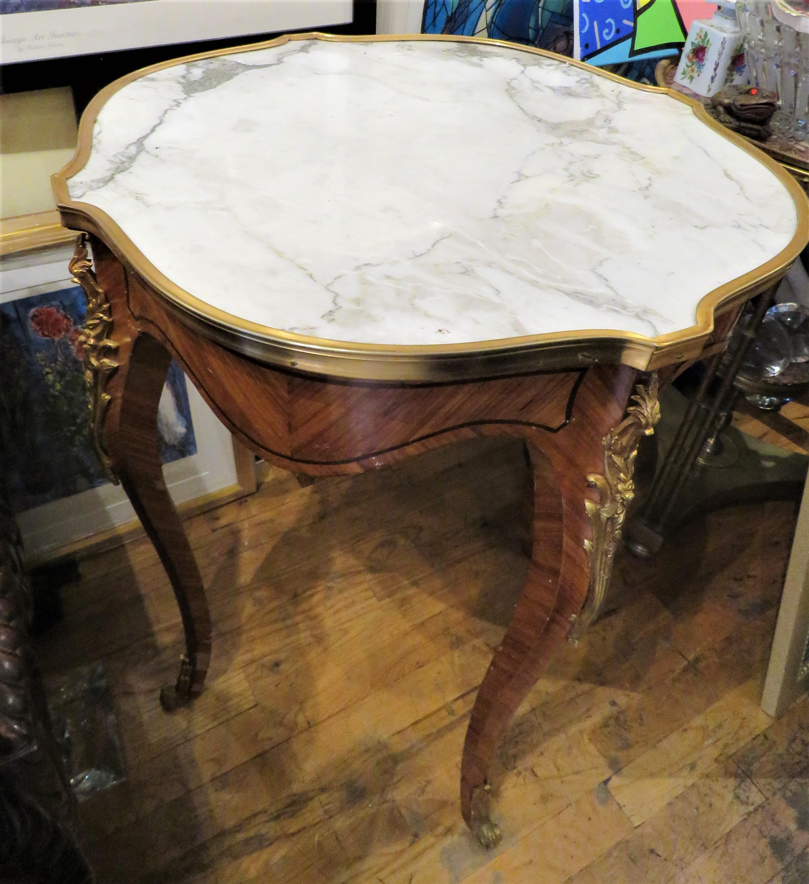 The Following Item we are Offering is a Rare Outstanding 19th Century Museum Quality French Mahogony Marble and Bronze Table. Table is done with Outstanding Scrolled Bronze Detail. Structurally sound and in good condition. Minor areas of wear that