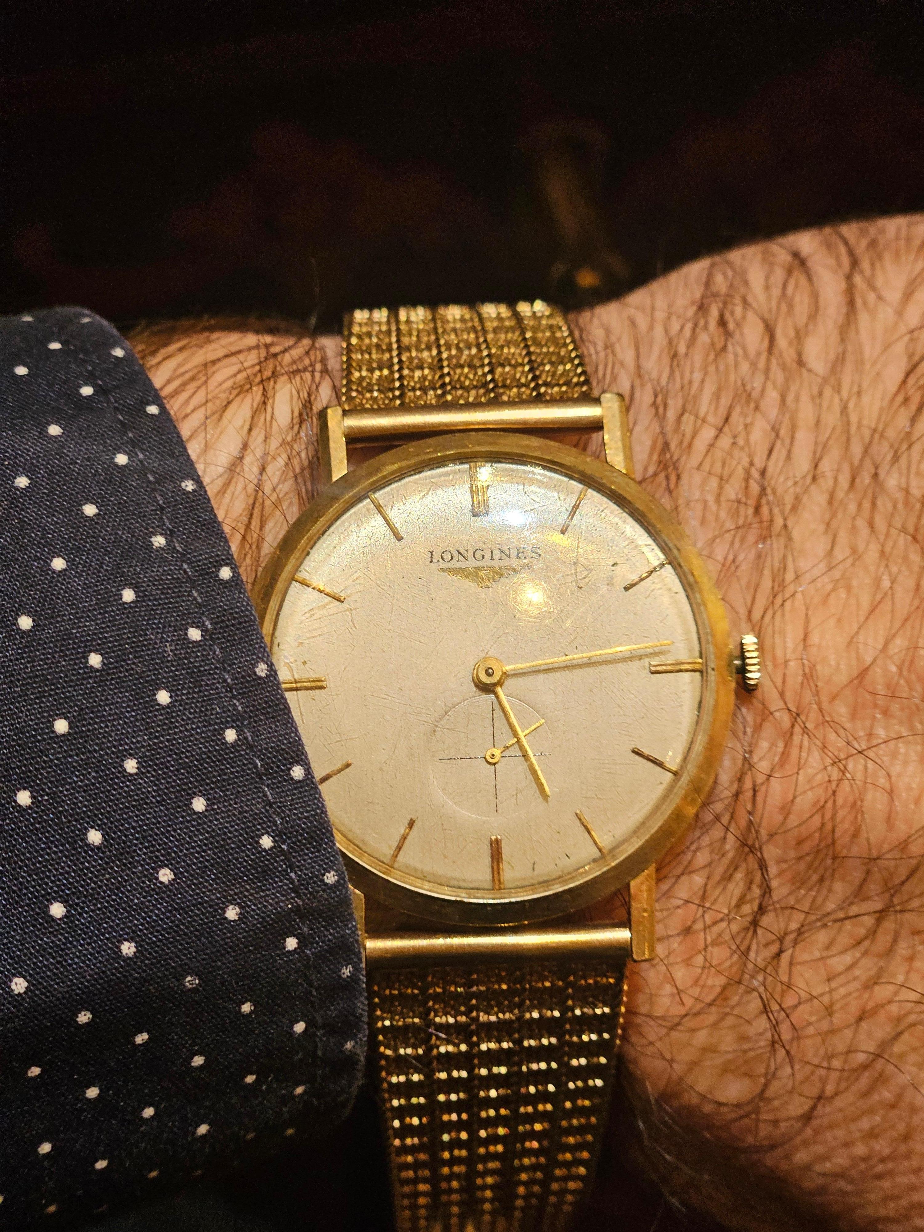 The Following Item we are offering is this Rare French Swiss Important Estate 14KT Gold Longines Watch with 14KT Gold Watch Band. Beautifully done and accompanied with a second hand dial. Taken from a Several Million Dollar New York City