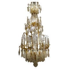 Importante lampadario francese in cristallo di rocca e bronzo dorato di Georges Hoentschel