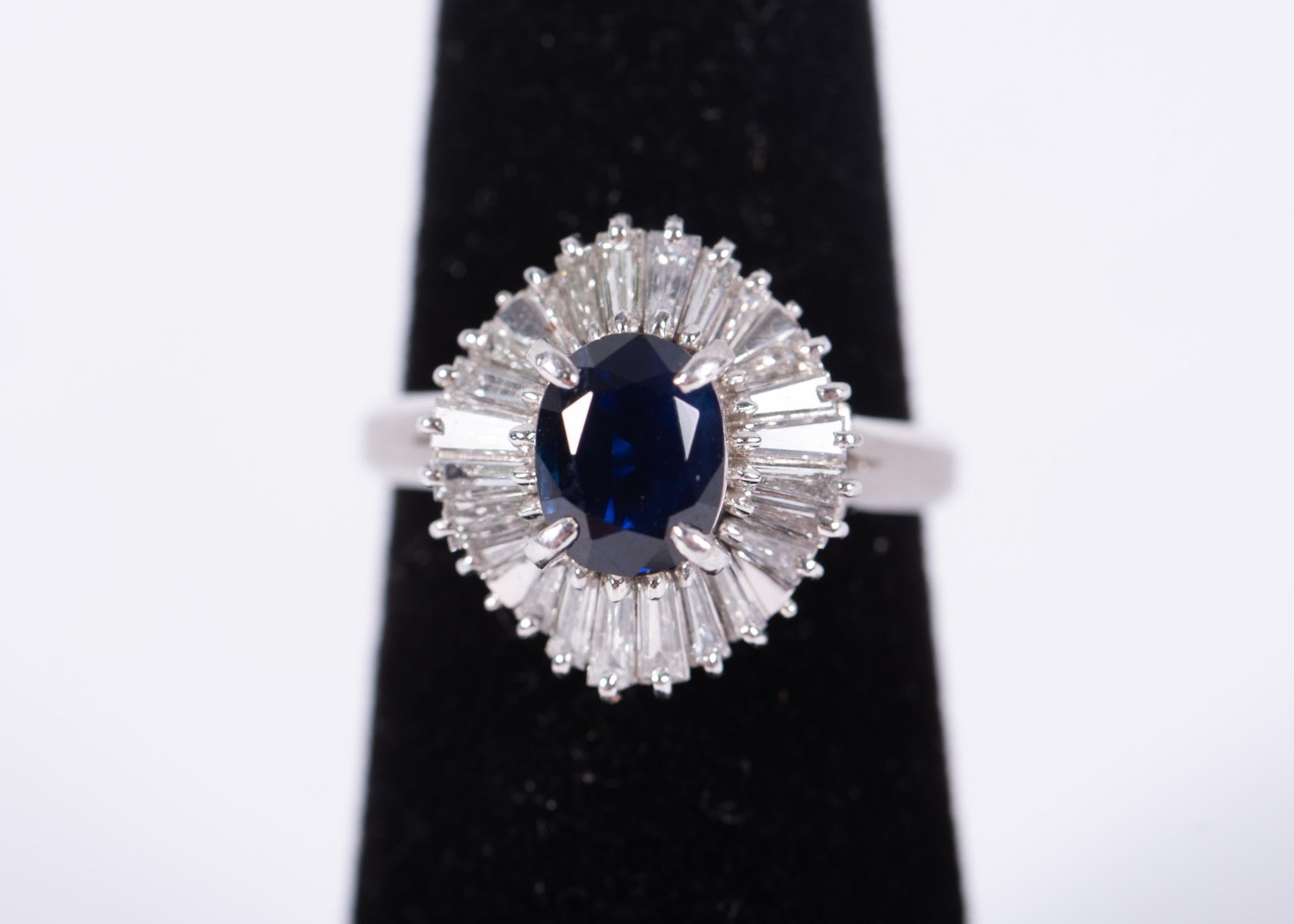 The Following Item we are offering is a Rare Important Radiant Platinum Large Rare Fancy Gorgeous Oval Blue Sapphire and Diamond GIA Certified Ring. Ring is comprised of a Fancy Oval Cut Rich Natural Unheated Blue Sapphire surrounding baguette