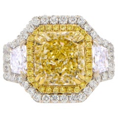 Importante bague en or 18 carats avec diamant jaune fantaisie naturel certifié GIA de 5,23 carats