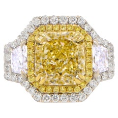 Importante anello con diamante giallo naturale fantasia certificato GIA da 5,23 carati in oro 18 carati