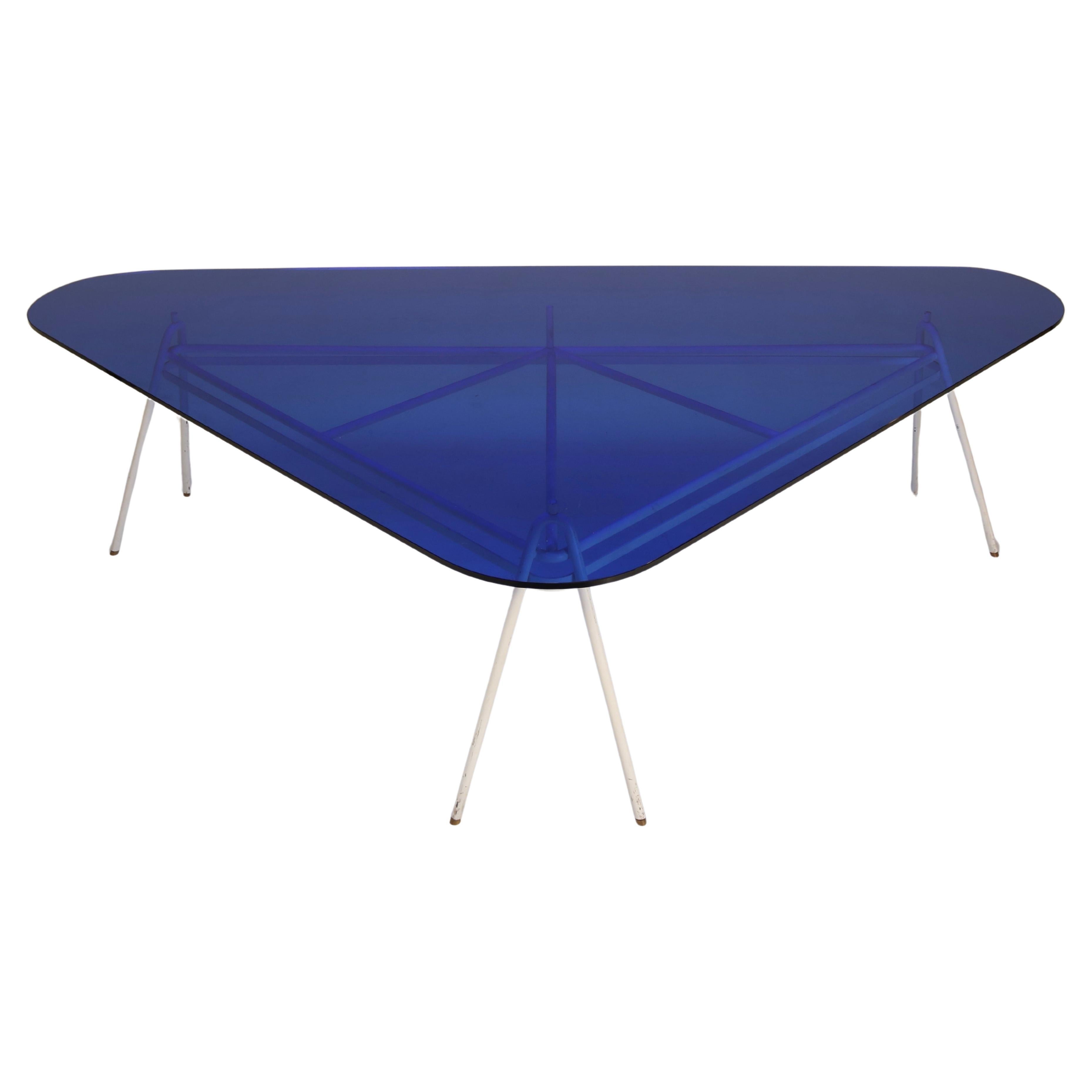Rarely do meeting tables manage to be both functional and so aesthetically appealing as this example, made by Guido Buratti in the 1980s and preserved by the original ownership to this day. The essential lines of the lacquered tubular metal supports