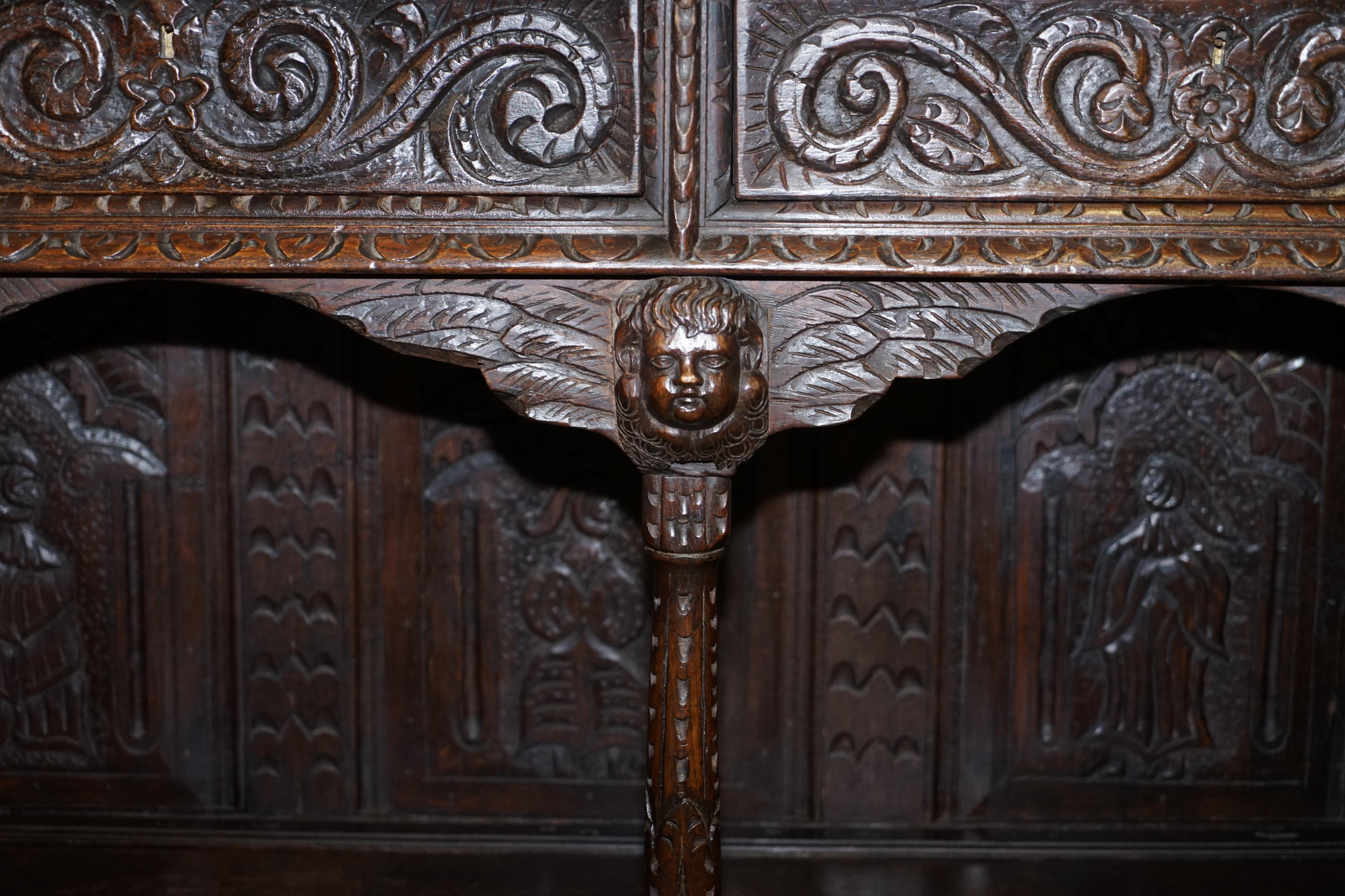 English Important Gothic Revival Using 17th Century Panels Bookcase Dresser Cherubs For Sale