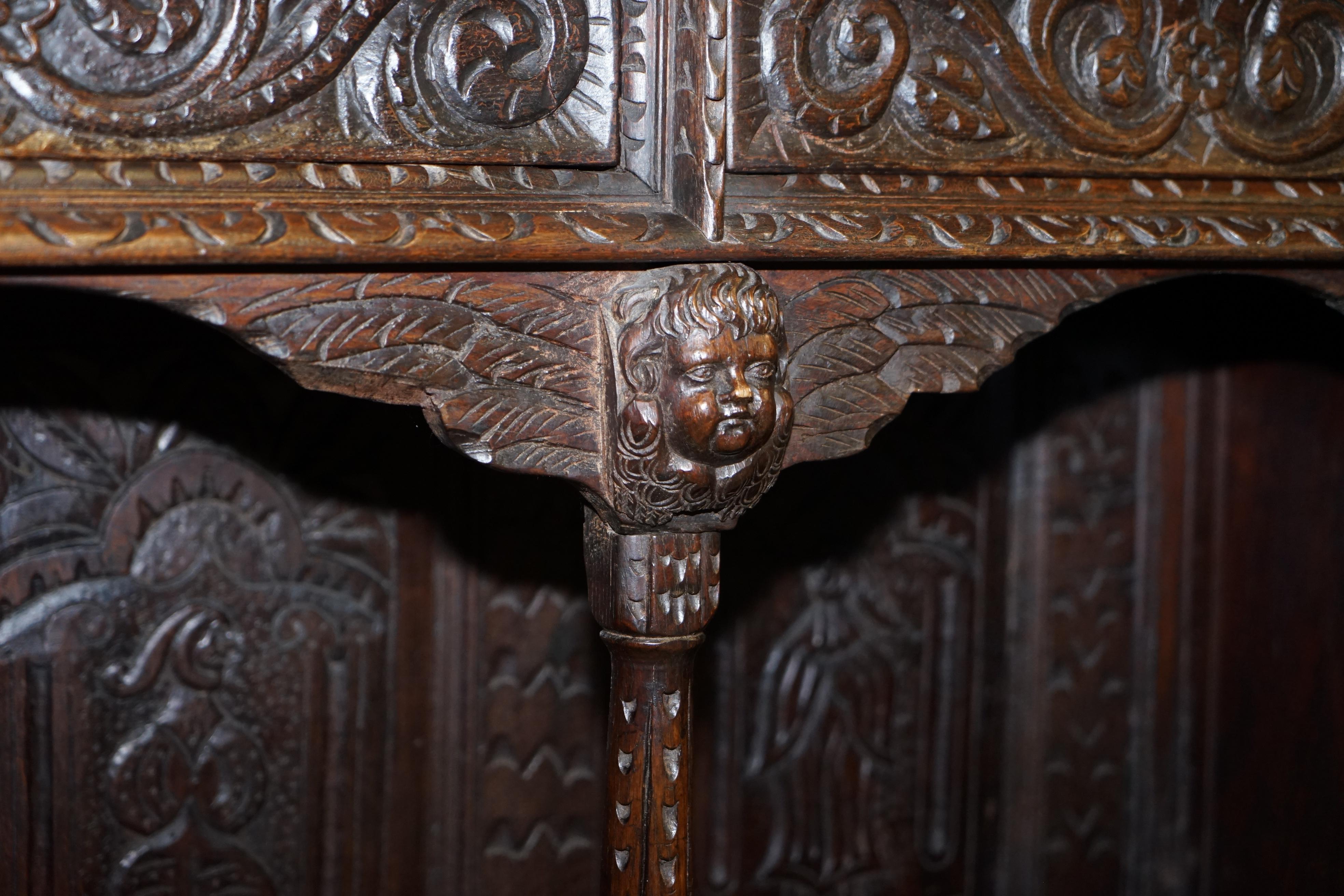 Hand-Crafted Important Gothic Revival Using 17th Century Panels Bookcase Dresser Cherubs For Sale