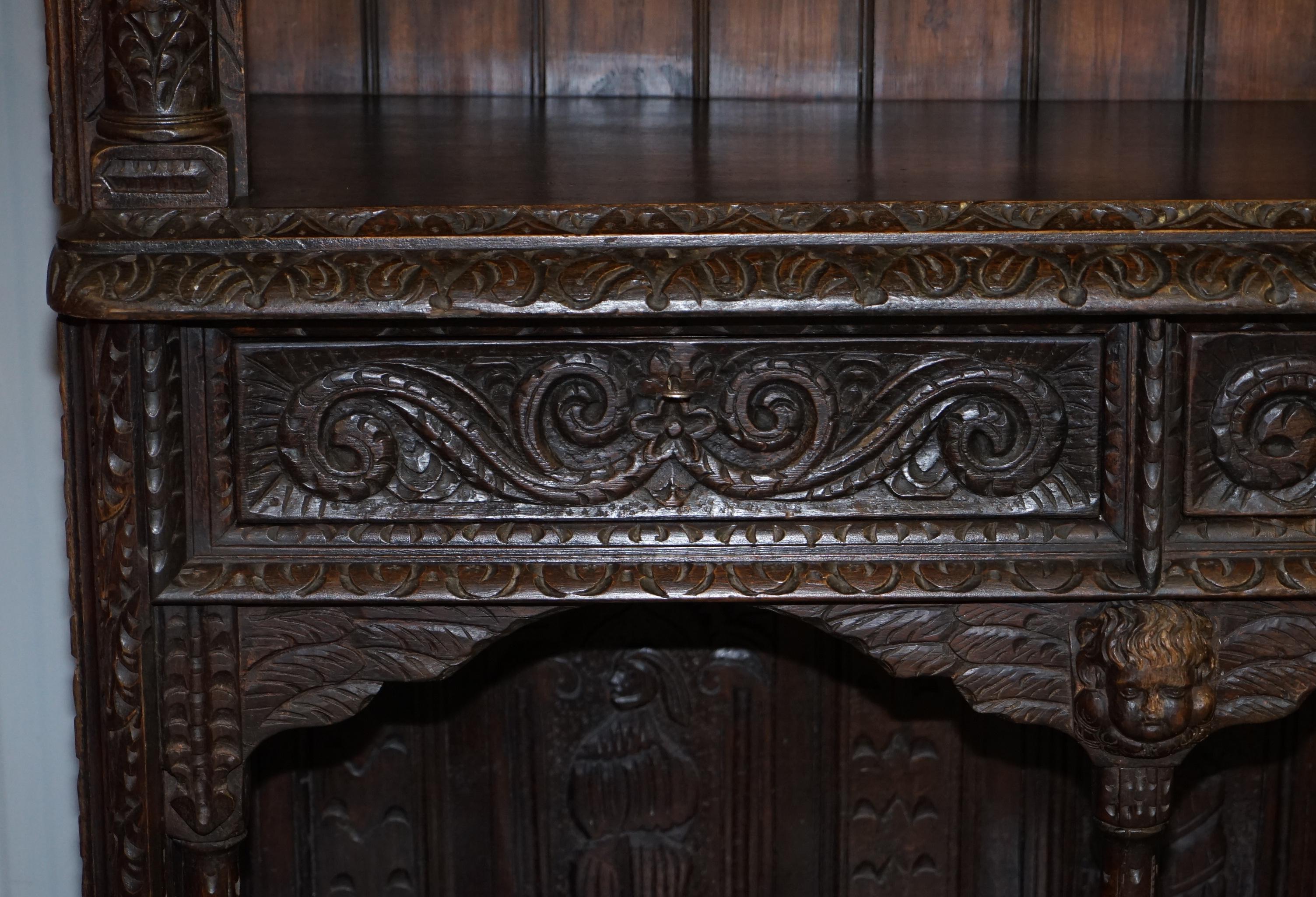 Oak Important Gothic Revival Using 17th Century Panels Bookcase Dresser Cherubs For Sale
