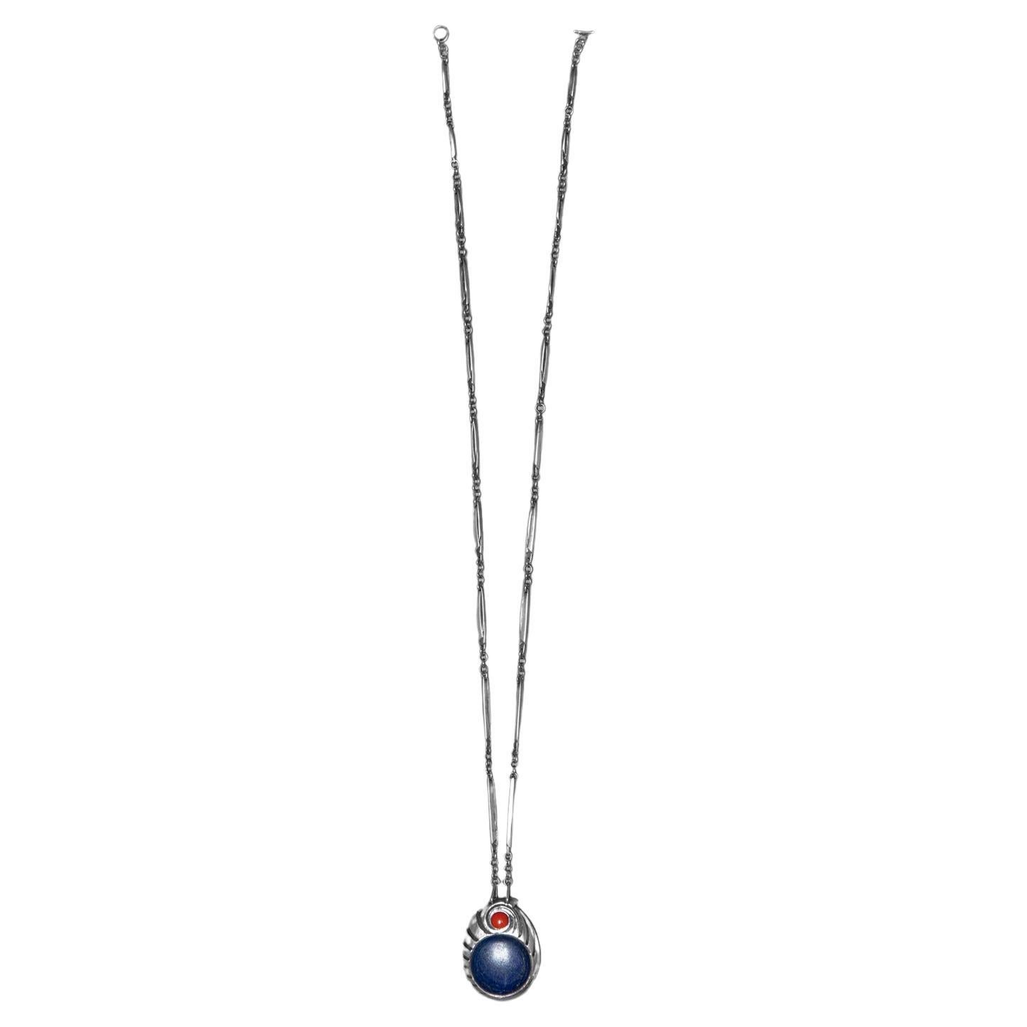 Extremely rare combination pendant attached to custom-made chain by Harry Bertoia in sterling silver, containing one Lapis Lazuli and one Coral.  This piece comes from a private collection. Provenance will accompany the piece. The work has been