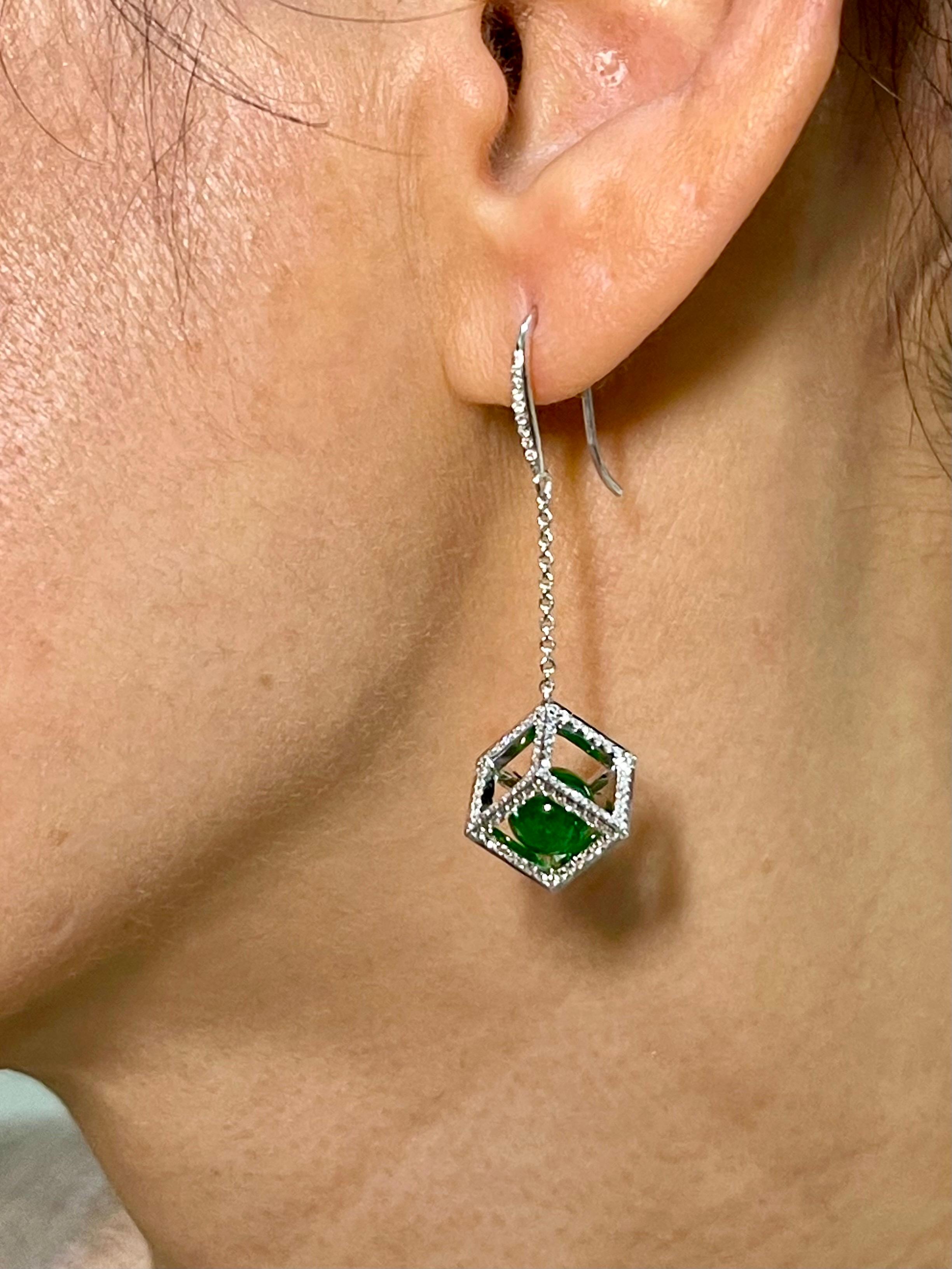 Please check out the HD video. This is a very special pair of earrings. Made with the best imperial jade beads. They GLOW! The jade in these earrings are certified to be natural jadeite jade. The earrings are set in 18k white gold. There are 2