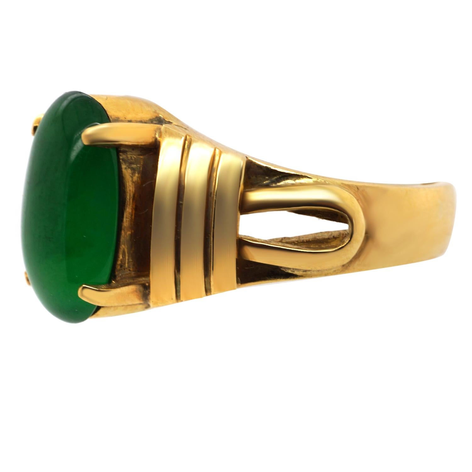 Crafted in 20 karat yellow gold this ring features a very important Jadeite Jade oval cabochon measuring 12.27 x 7.45 x 3.29mm. Ring size 9.  Weighs in total 7.4 gr/4.7 dwt.  Stamped 