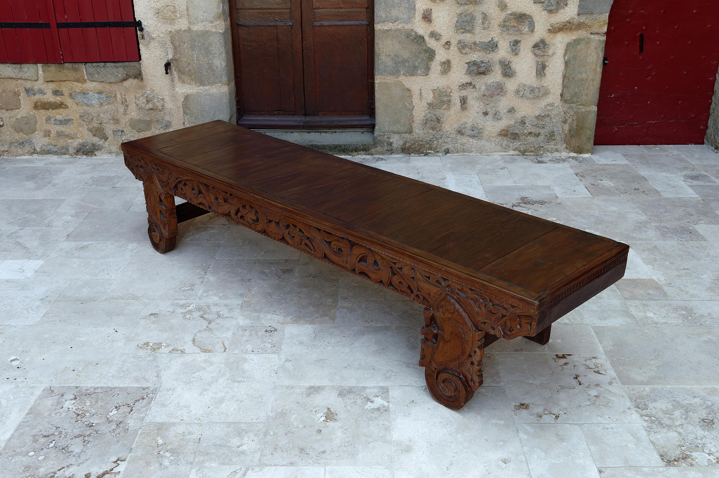 20th Century Important Indonesian bench in carved wood, Early 20th century For Sale