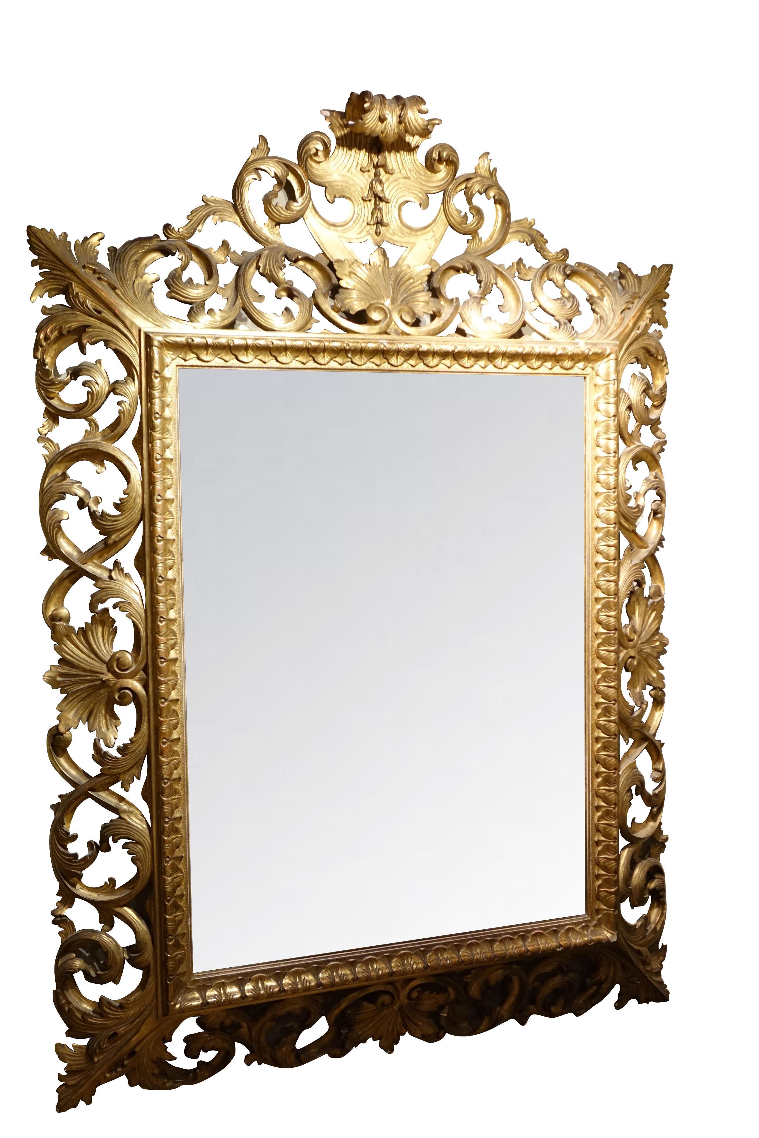 Important mirror in inverted profile, finely carved in an openwork of curls and foliated foliage scrolls.
Gilt wood with original gilt leaf, original central beveled mirror, good general condition.
Italy, Tuscany(?) ,19th century