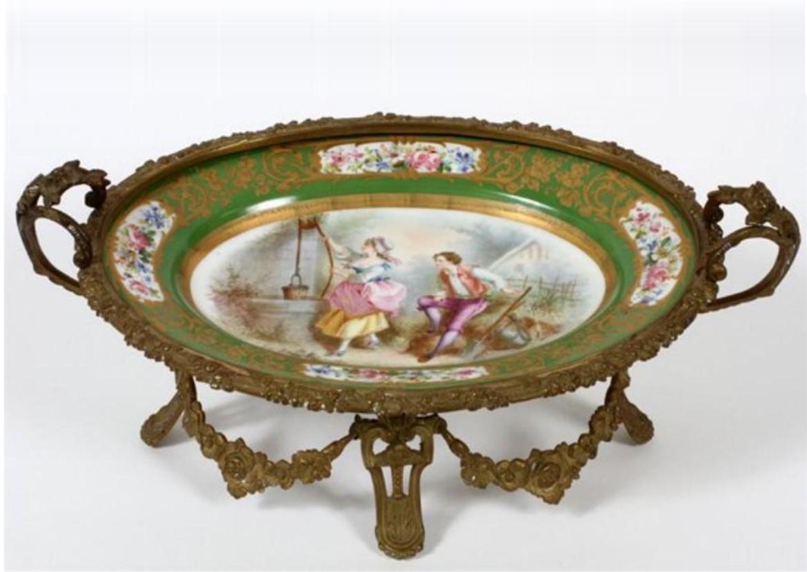 The Following Item we are offering is A Beautiful Rare 19th Century Fine French Gilt Bronze and Green Sevres Porcelain Center Dish. The bronze double handled and footed centerpiece features a signed hand painted Sevres porcelain bowl. The scene