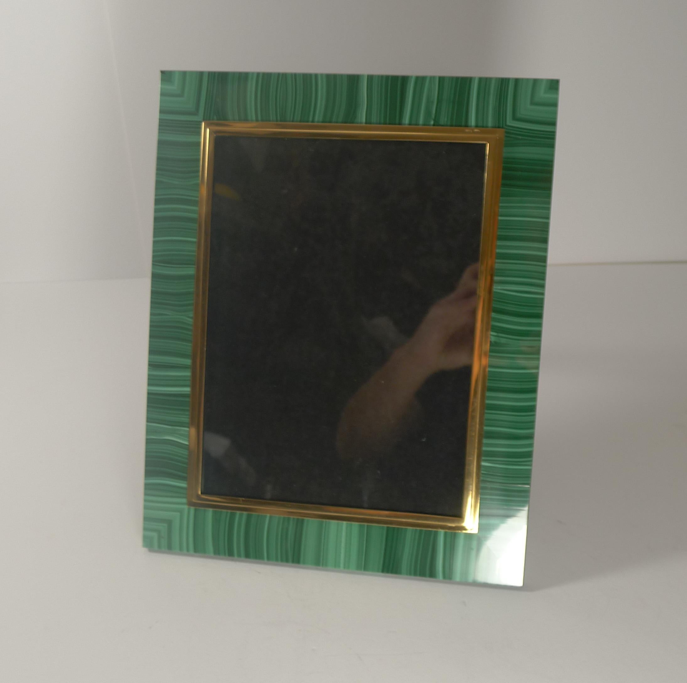 A rare vintage photograph frame and a wonderful large example. Made in Italy c.1950, the vibrant green Malachite stone adds some Hollywood glamour to your interior. The glazed aperture is edged in solid 800 grade silver and smothered in gold.

The