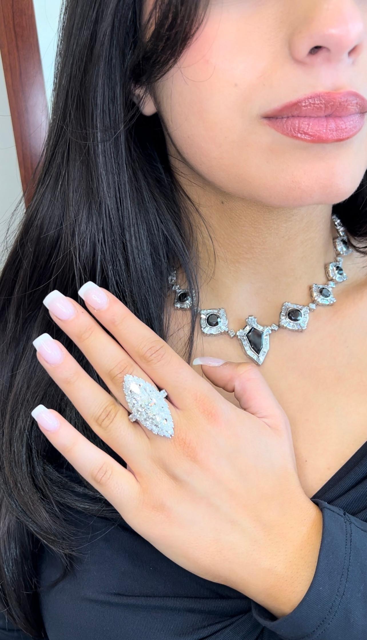 True Elegance of the Marquise Diamond. This Ring is the ultimate diamond ring for the marquise lovers. An 18k white gold (750 Hallmark), finely crafted using large marquise stones throughout the top of this ring. The center diamond is a solitaire