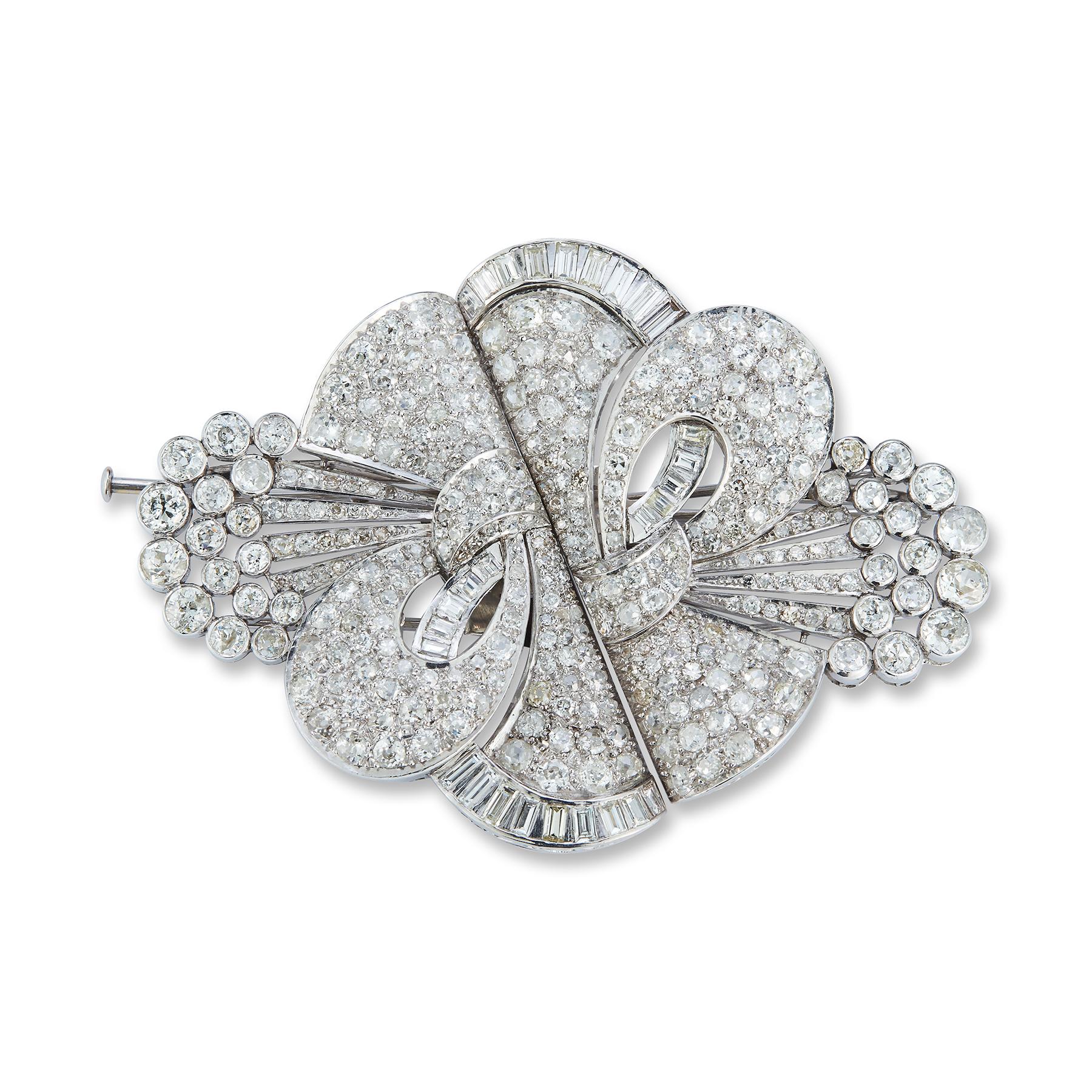 Important Large Size Art Deco Diamond Brooch

Total diamond weight approx 25.54 ct 

Brooch detaches into two clip 

Approx 3.25 inches long!
2.50 inches at it's widest

Made Circa 1930