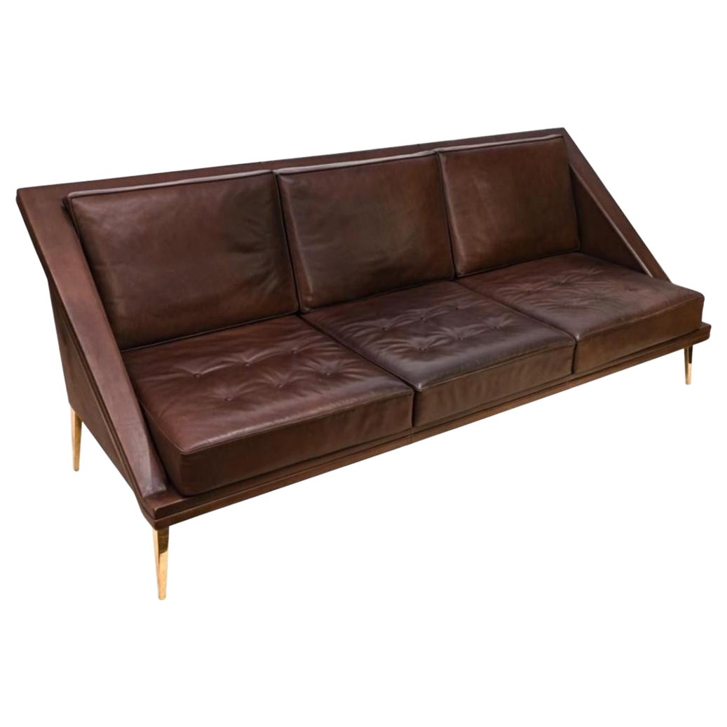 Charles Ramos, rare, leather sofa on gilded aluminum legs. Minimal, elegant, graceful and yet comfortable. Made in France around 1958, a true, hard to find piece.
Coming from a cabinetmaker family, Charles Ramos was a self taught designer and