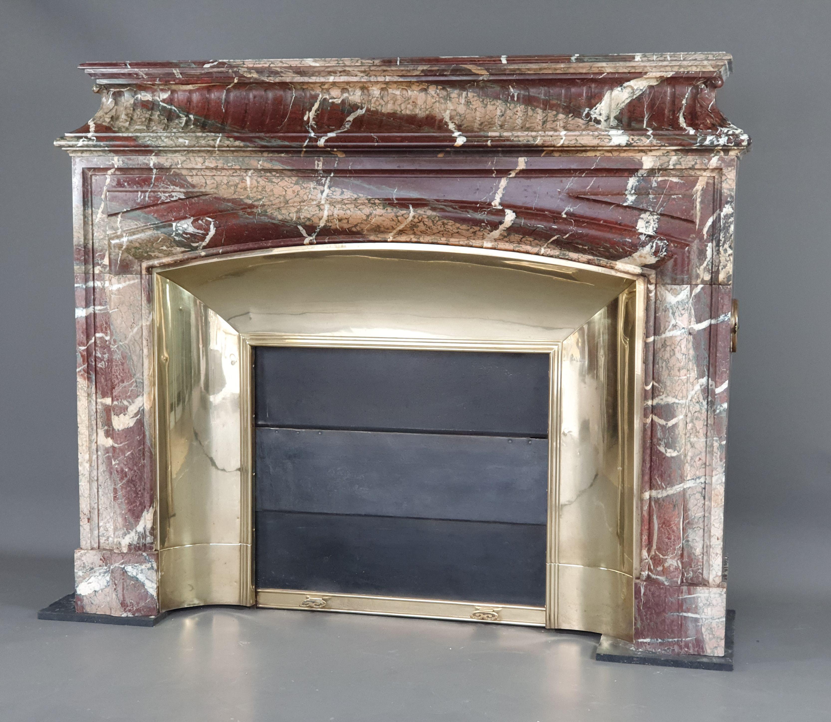 French Important Louis XIV Fireplace With Acroterion In Campan Grand Mélange Marble For Sale