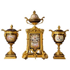 Important Louis XVI Style Gilt Bronze and Porcelain Clock Set Garniture