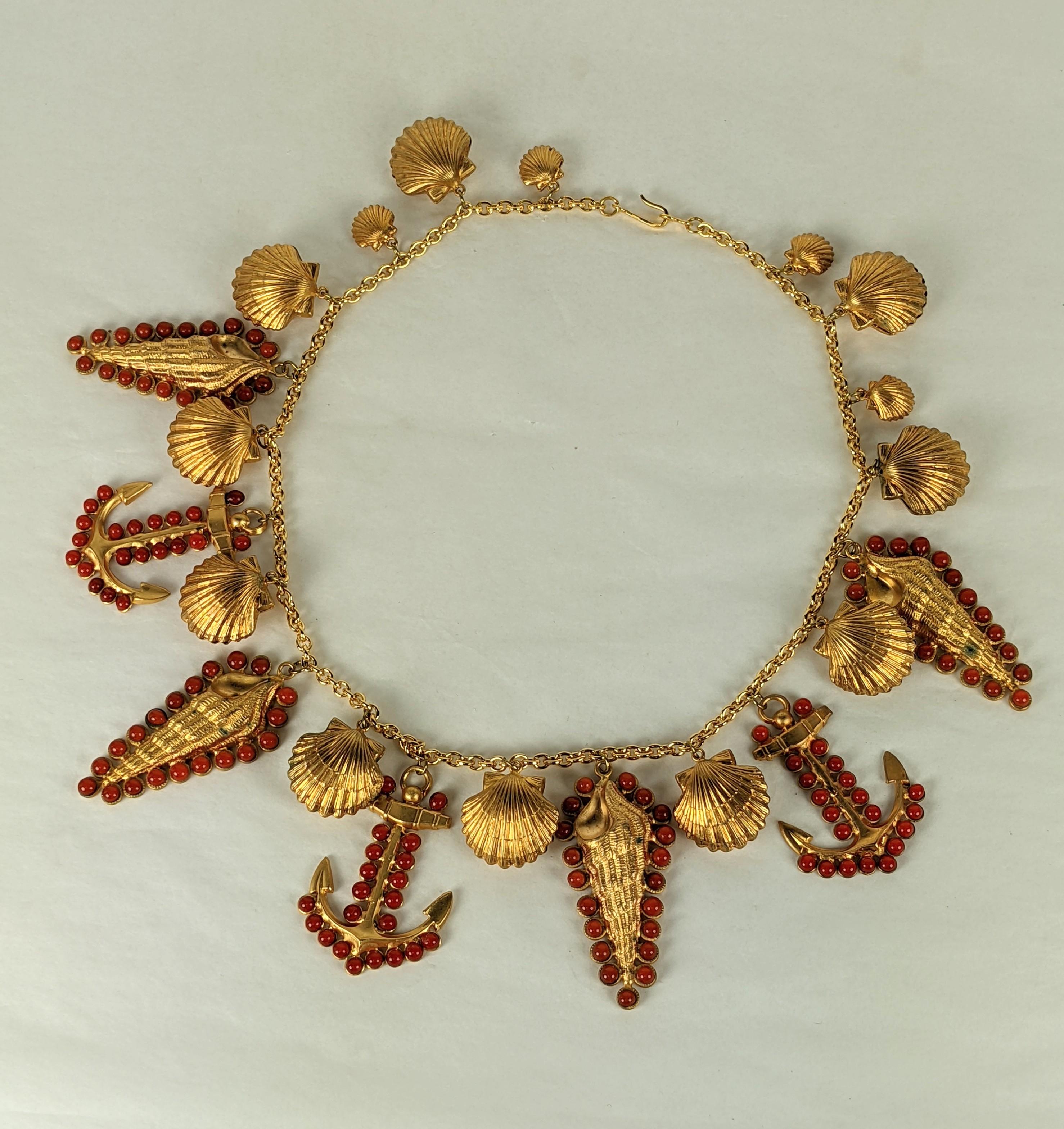 Extraordinary and iconic Maison Gripoix for Yves Saint Laurent nautical themed necklace. Of gilt plate bronze and coral Gripoix poured glass enamel ship anchors and varied seashells. Exquisite workmanship. Marked France.
An example of a necklace