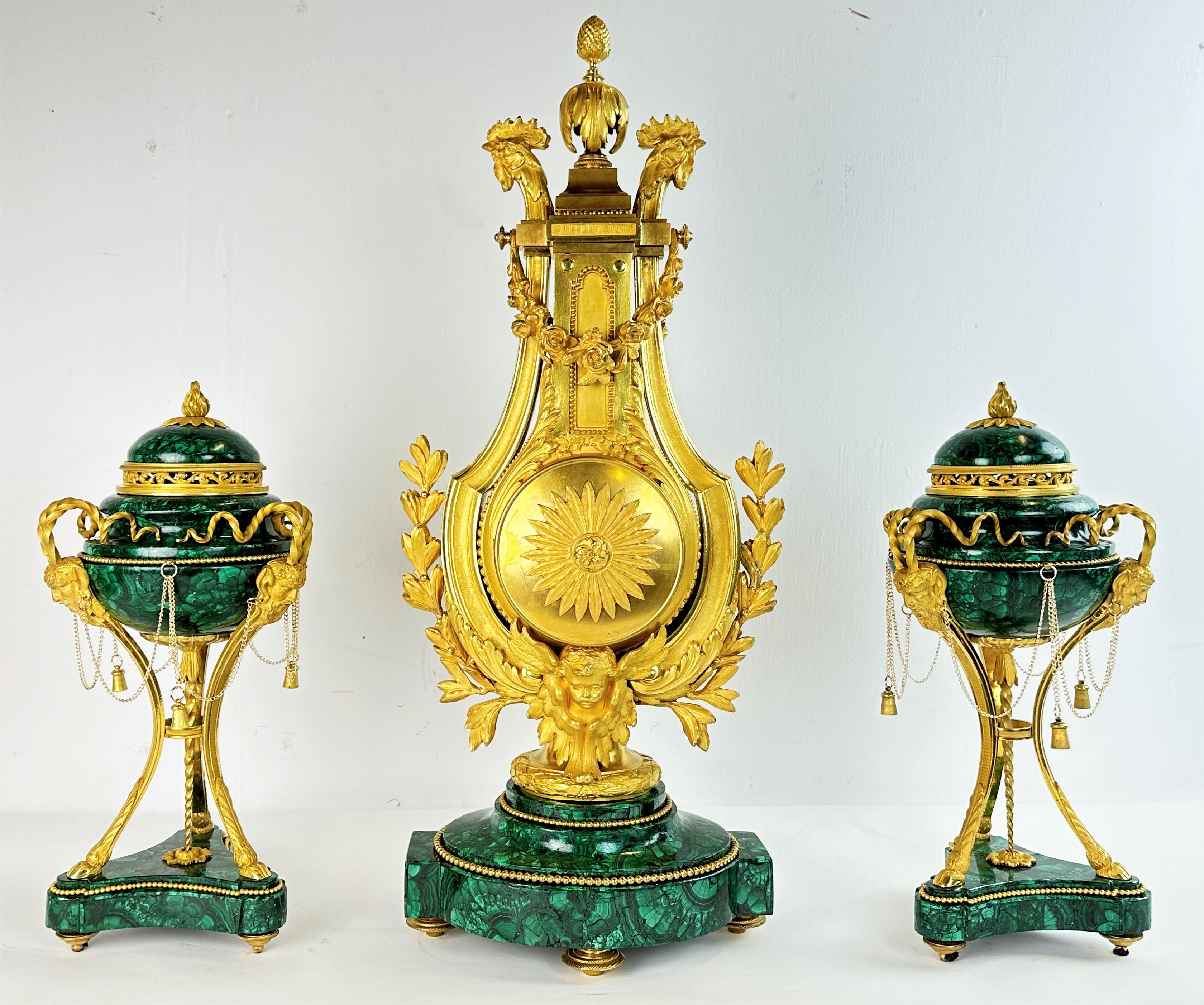 An amazing Louis XVI style suit consisting of a clock and two vases. Made of a combination of the highest quality gilded bronze castings and malachite elements, France, second half of the 19th century, around 1880. Signed 