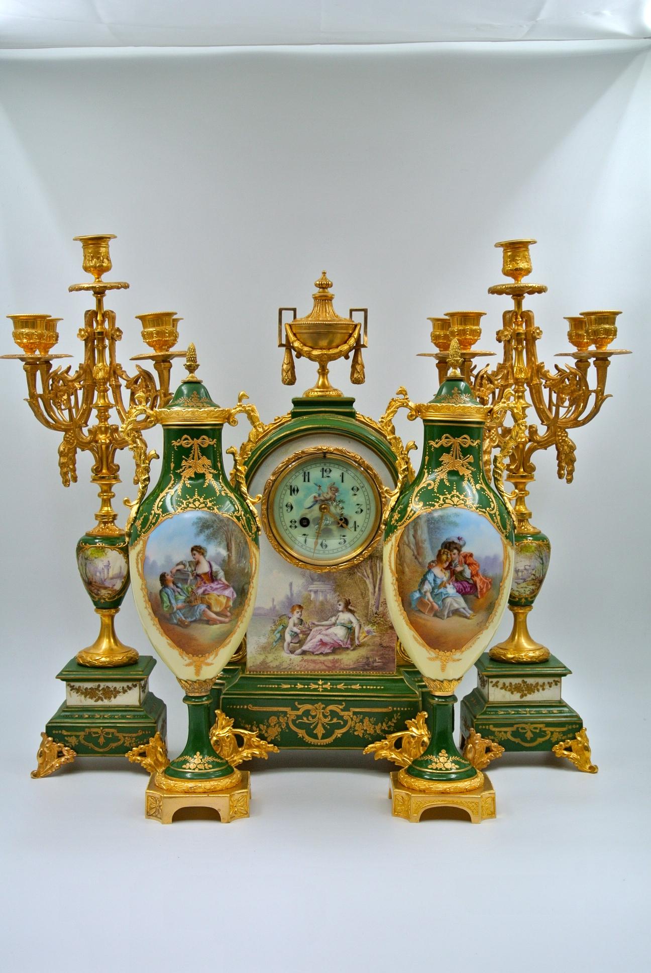 Important mantel set in painted and gilded bronze porcelain, Napoleon III period, 19th century.
Measures: Clock: H 50 cm, W 29 cm, D 16 cm
Candelabra: H 52 cm, W 19 cm, D 20 cm
Cassolettes: H 42 cm, W 14 cm, D 14 cm.