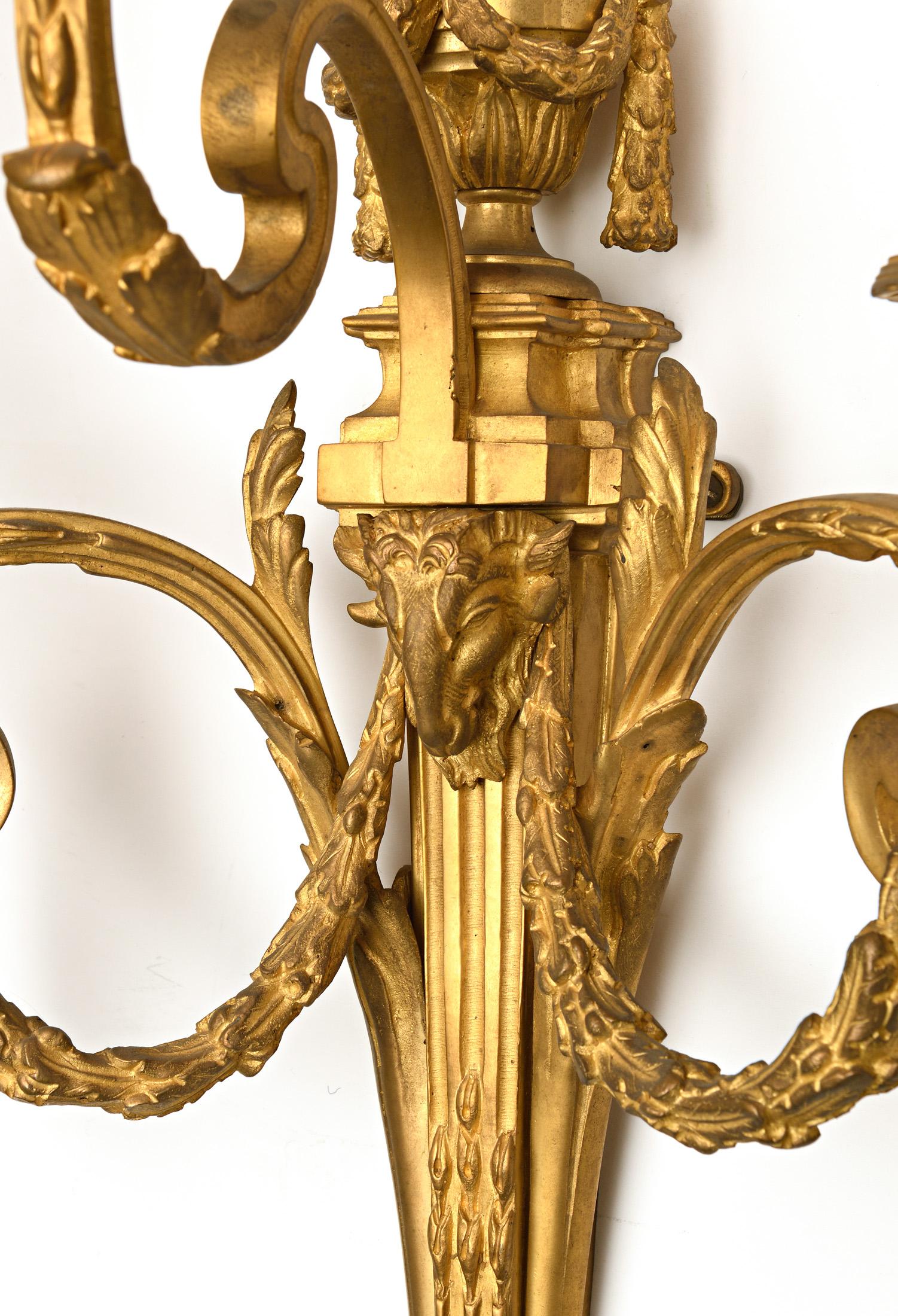 Exceptional match pair of sconces
Superb suite of four Louis XVI style scones in gilded bronze with heads rams and garland
These four sconces are exactly the same size and have a very slight difference in the light of the middle on one of the pairs.