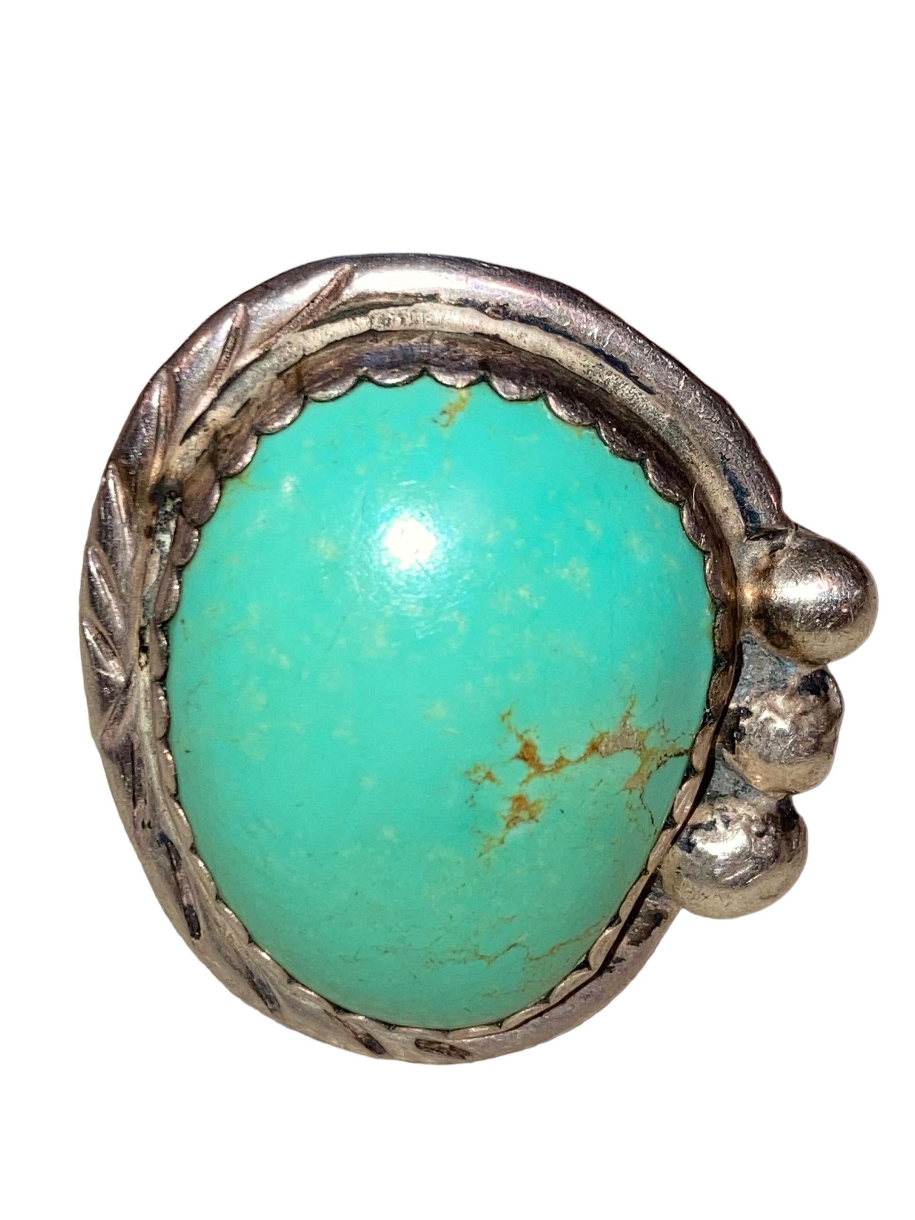 This Men's Native American Sterling Silver Bird's Eye Turquoise Navajo Ring was crafted by master silversmith Verdy Jake. She was born in 1953 and by the 1970s had become a well known and respected Navajo jeweler. She was one of 13 siblings, taught