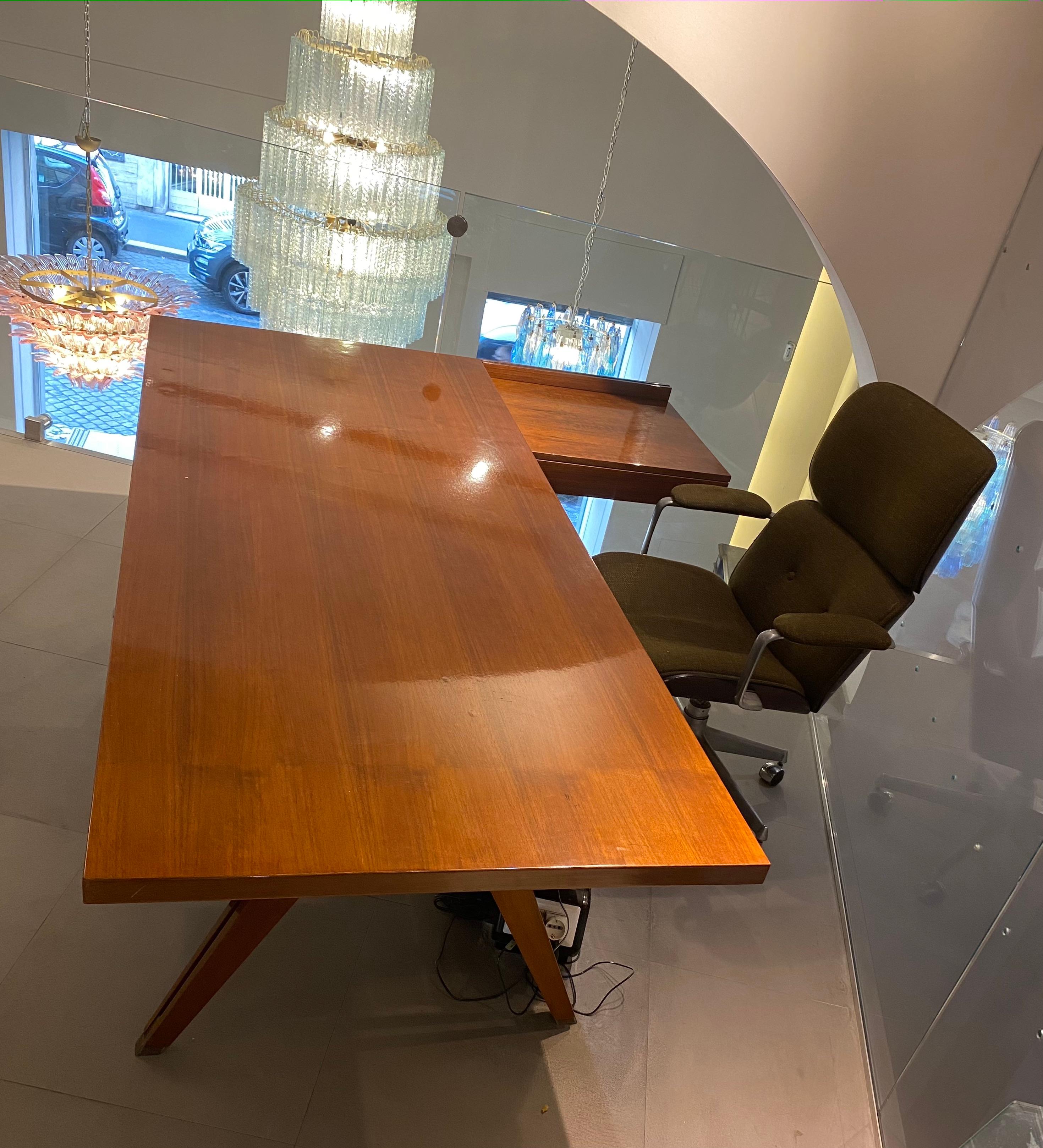 This large Terni executive desk was designed by Ico Parisi in 1958 for MIM (Mobili Italiani Moderni) Rome, Italy, with a rectangular tabletop, The desk contains a three drawer block on one side and a two drawer block on the back. That way the desk