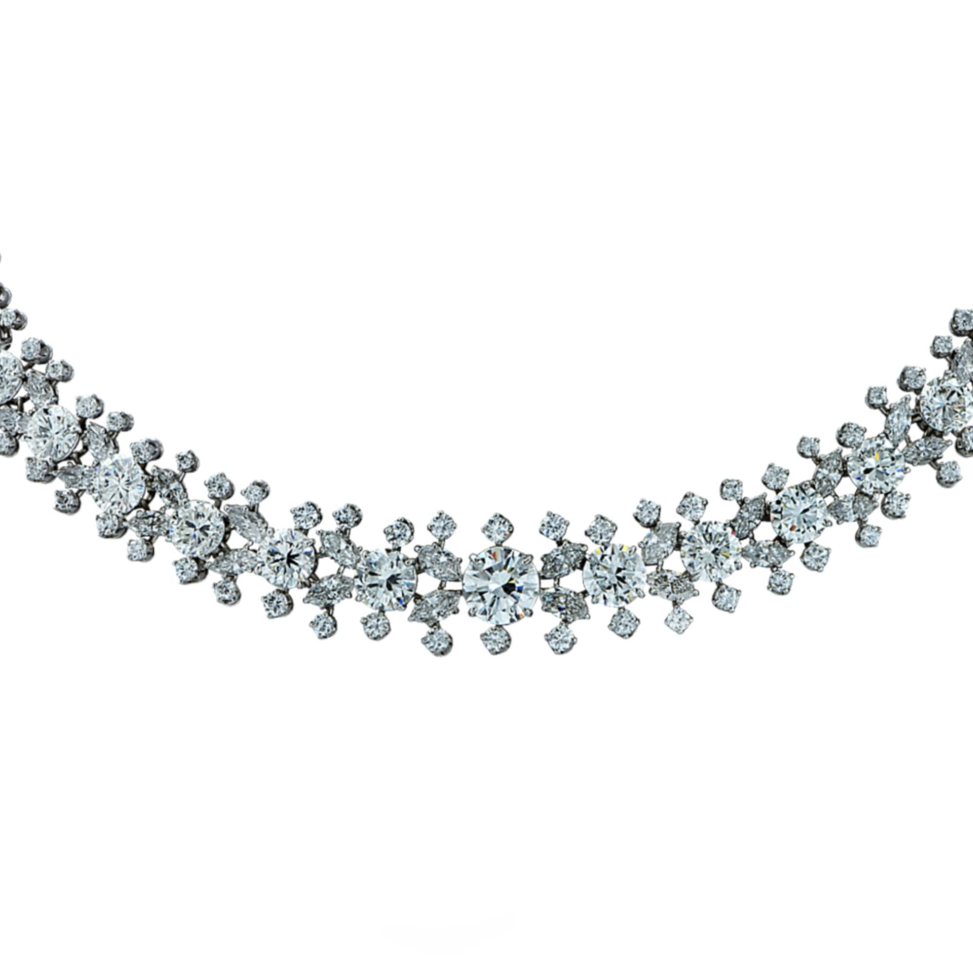 From the legendary house of Harry Winston, this exquisite necklace, expertly crafted in fine platinum by the renowned French jeweler, Francois Tavernier, showcases 52 carats total weight of collection diamonds set in a stunning floral design. This
