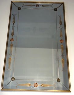 Important miroir gravé de décorations dorées et rouges. Travail français. Circa 1970