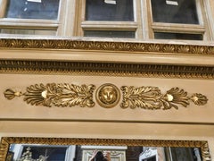 Important mirror in yellow lacquered wood rich golden floral decoration, Italy