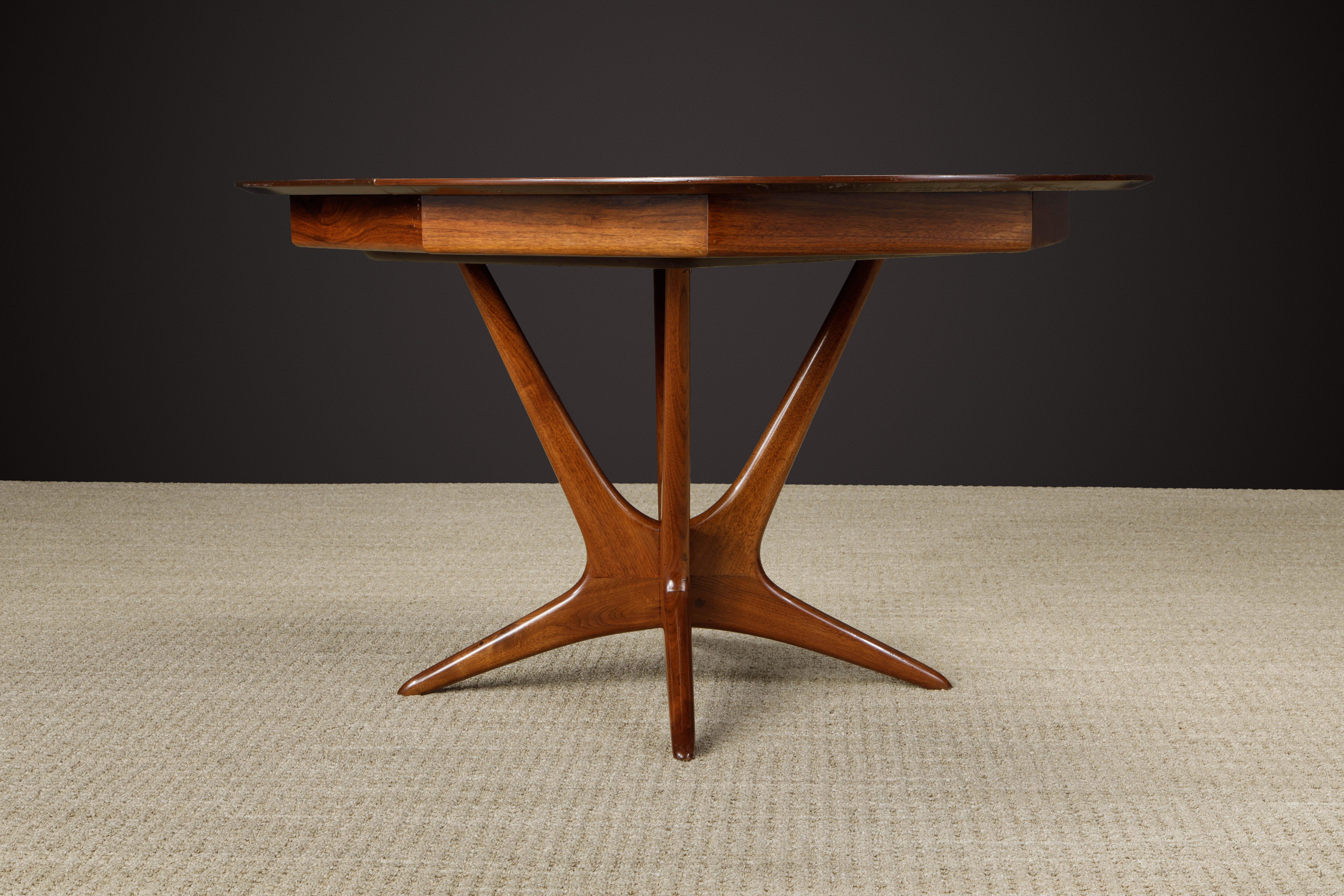 This rare and important model #VK-2060 sculptural 'Walnut Pedestal Dining Table' by Vladimir Kagan for Kagan-Dreyfuss was designed and produced in the 1950s, during Kagan's partnership with Hugo Dreyfuss which ended in 1960 making signed items