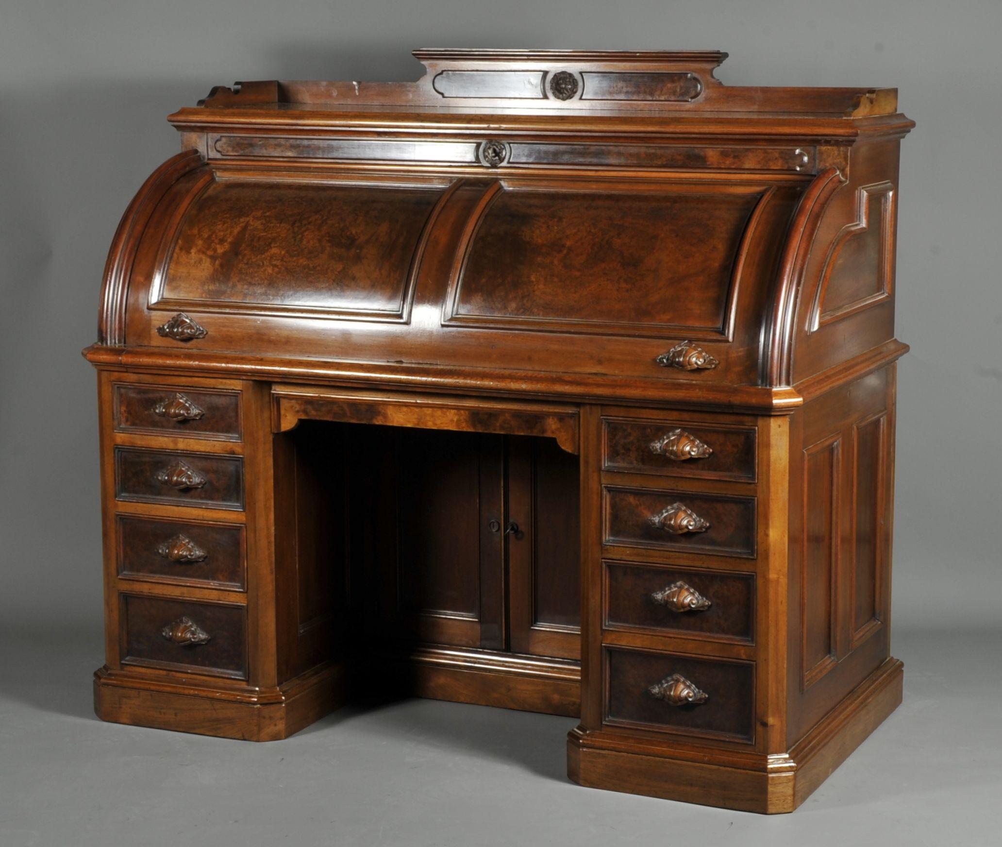 Magnificent and very imposing Napoleon III cylinder secretary made of burl walnut and solid walnut.

Mounted on plinths, it has eight drawers in front and a large cylinder opening a very beautiful theater composed of a folding top covered with
