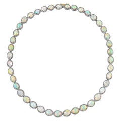 Important collier d'opales serti de 60 carats de diamants de 19,5 pouces au total