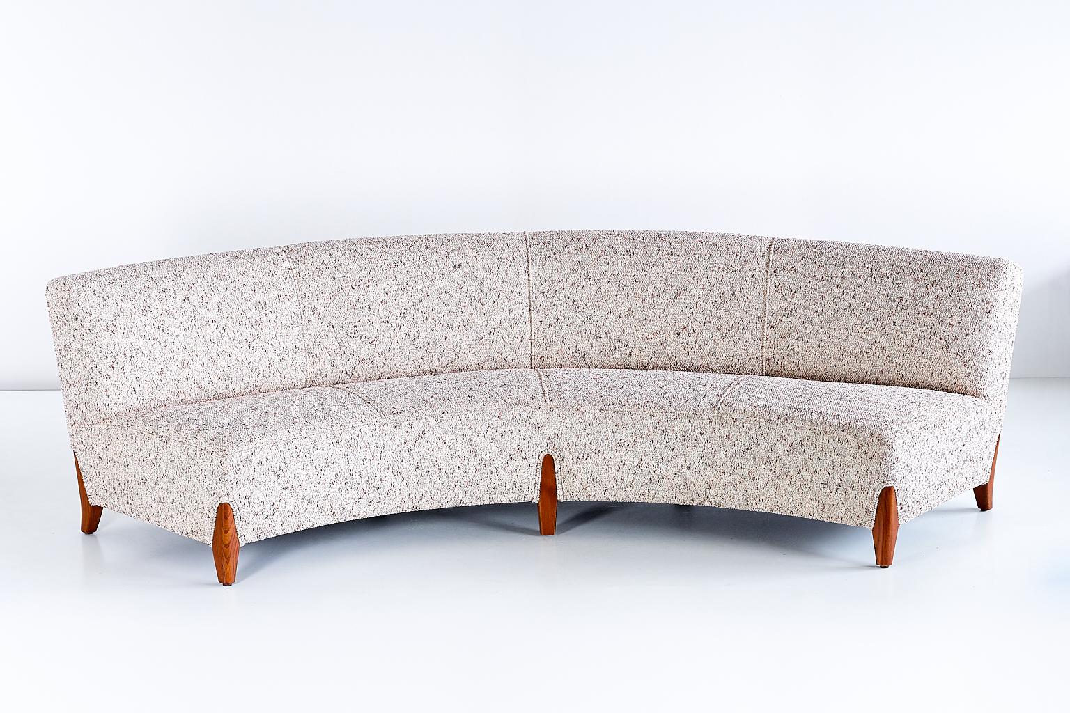 This important curved sofa was designed by Otto Schulz and produced by his company Boet in Gothenburg. The generously sized sofa can comfortably sit four people. The sofa has been newly upholstered following the measurements and details of the