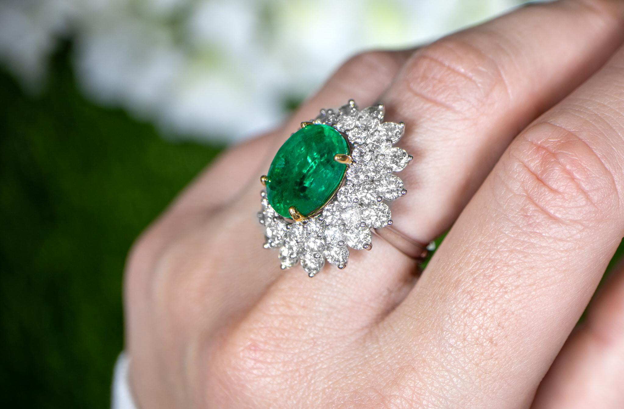 Contemporary Important Oval Emerald Ring With Diamond Double Halo 12 Carats 18K Gold For Sale