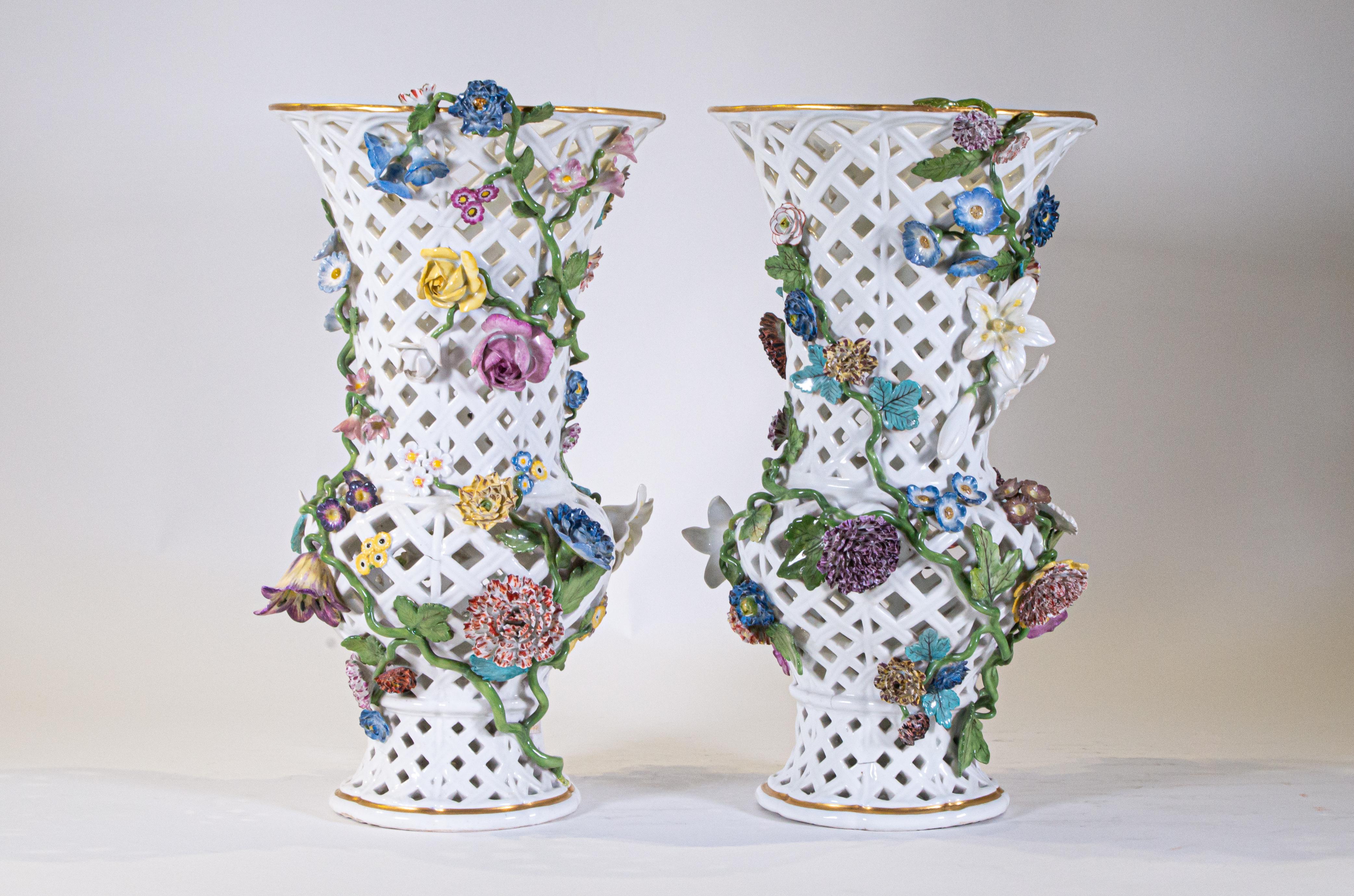 A Highly Important pair of Museum Quality Louis XV Period 18th century Meissen Porcelain filigree openwork vases with a medially of flowers and vined leaves. This is truly an exceptional pair of Meissen Porcelain vases with a truly gorgeous design