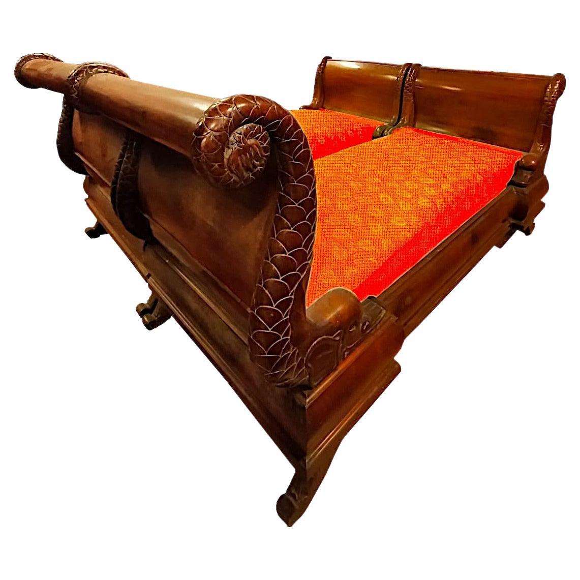 Important pair of boat beds with large carved dolphins, Empire, from 1810 Italy (Parma)

Circa 1810, in solid walnut with large carved dolphins forming the headboard and footboard.
The feet of the bed are also solid wood carved in typical Empire