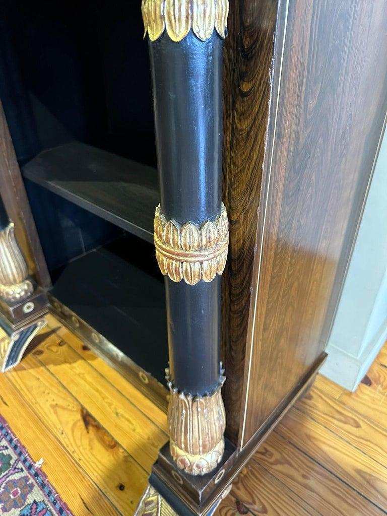 IMPORTANT PAIR OF EMPIRE SHELVES Napoleon III 19th century

French, 19th century 19th century, 
clad in rosewood wood, 
with three shelves, 
gilded carvings. 
Small defects. 
Dim.: 165 x 78 x 59 cm.
very good condition