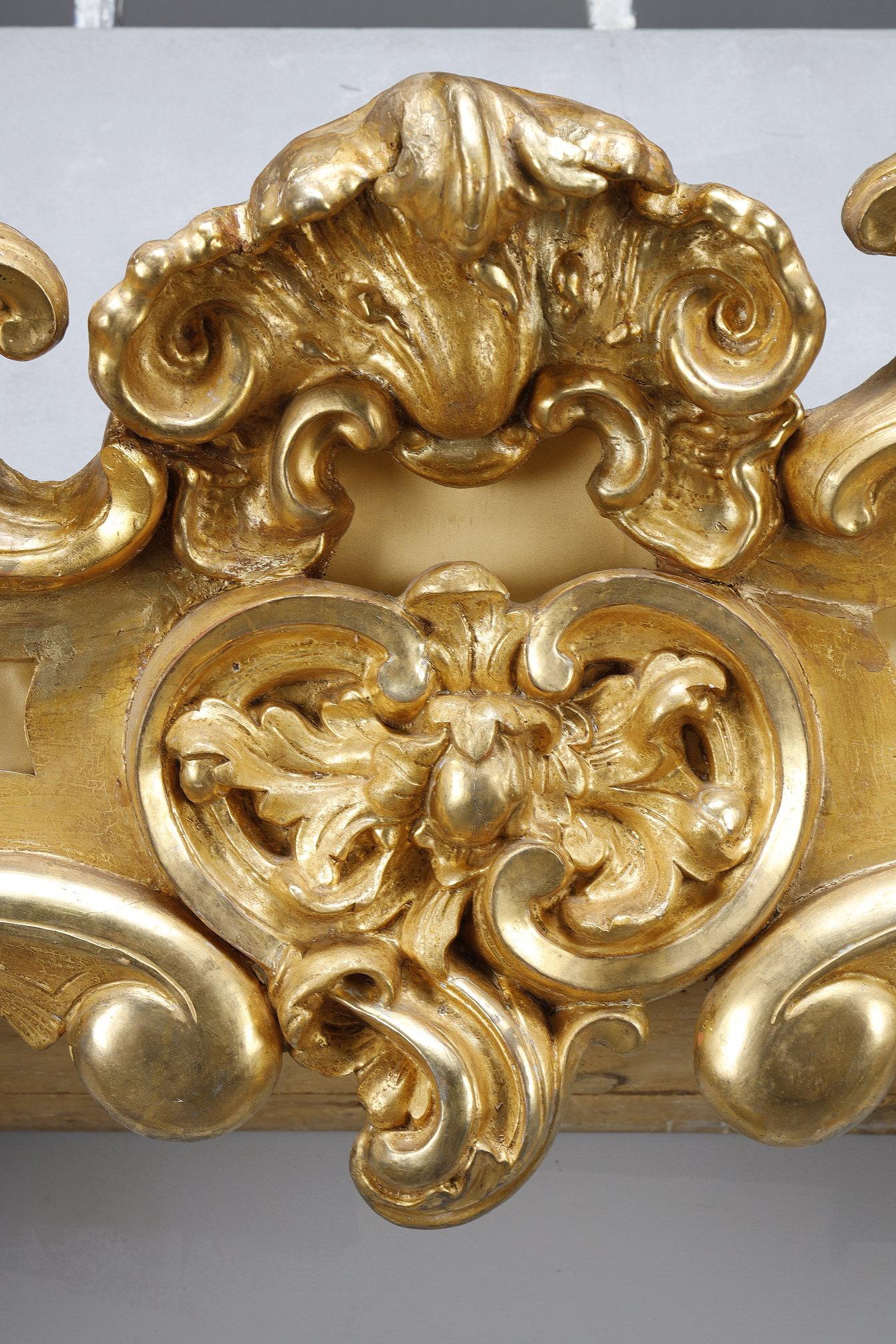 French Important pair of Louis XV style valances in carved and gilded wood