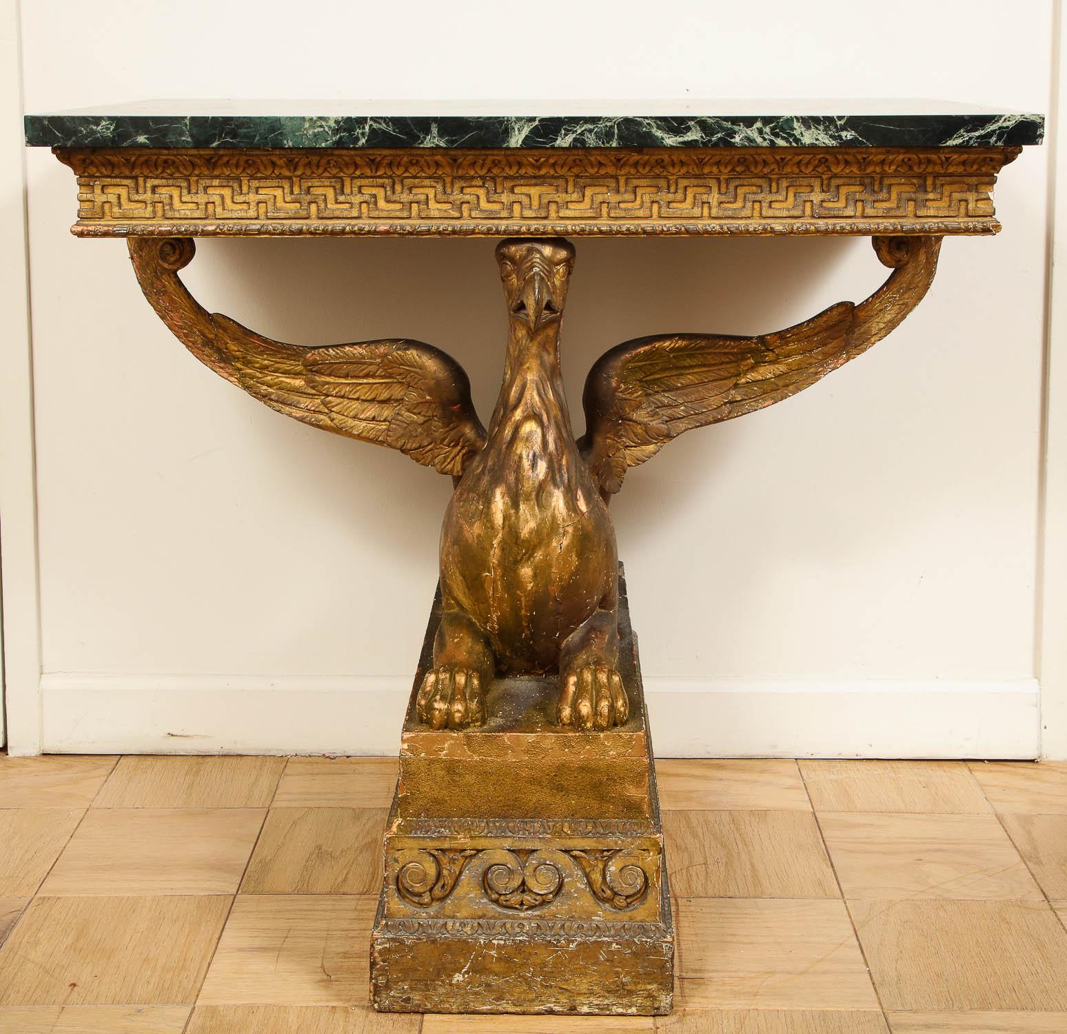 An Important pair of mid-18th century George II giltwood griffin console tables with rectangular Verde Antico marble tops. The magnificent pair of mid-18th century George II giltwood griffin console tables have rectangular Verde Antico marble tops