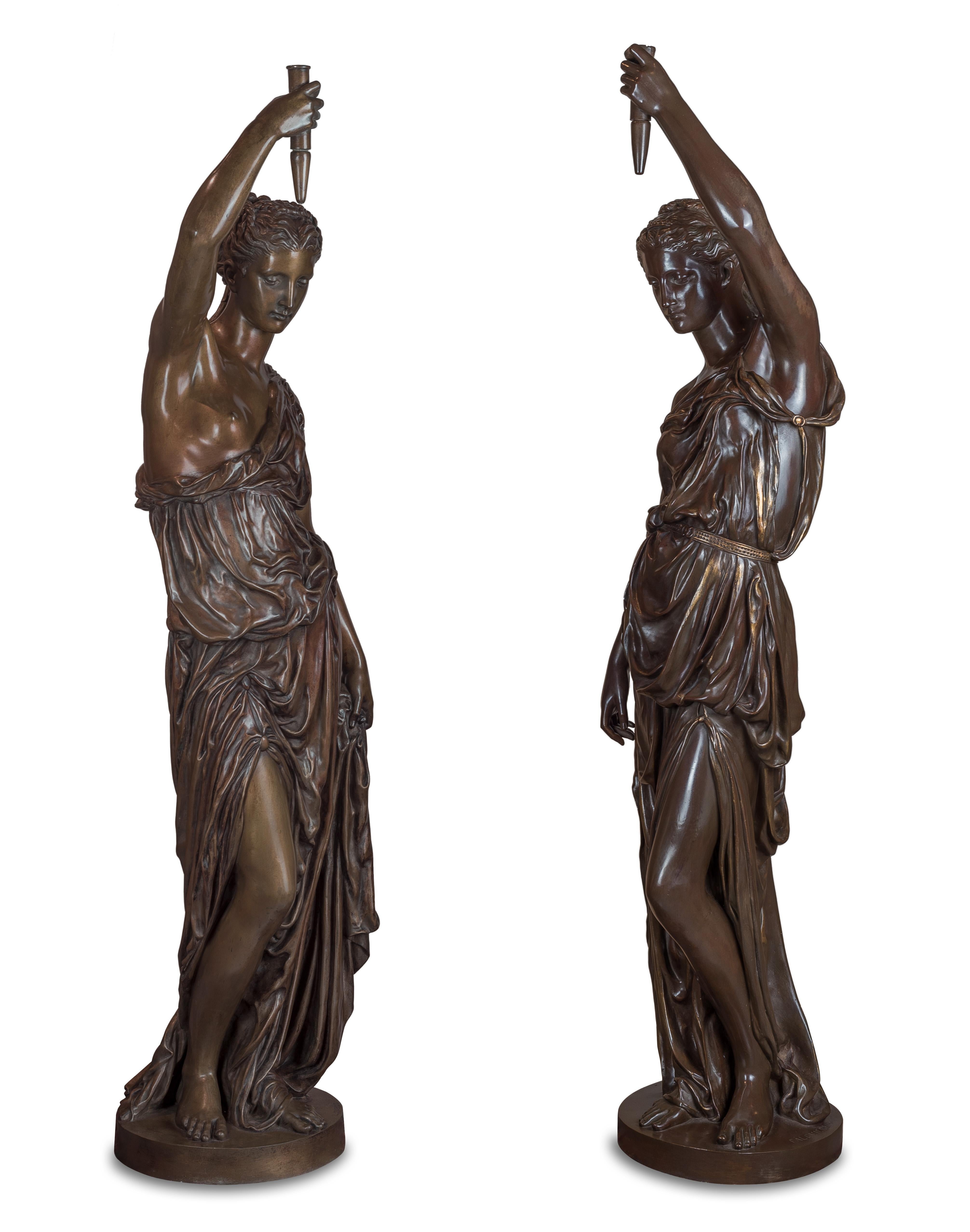 Mounted as lamps and cast by Ferdinand Barbedienne after models by Alexandre Falguiere and Paul Dubois. Both statues are signed on the bases. 

These fine torchères are reductions of a pair exhibited by Dubois at the 1867 Exposition Universelle,